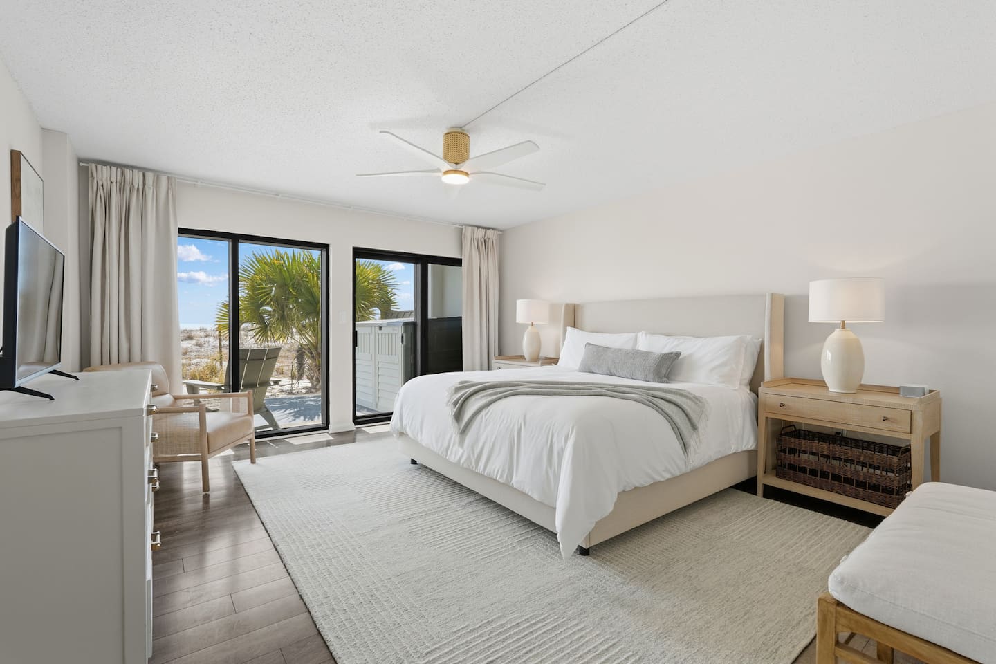 Primary bedroom has king bed plus access to private patio