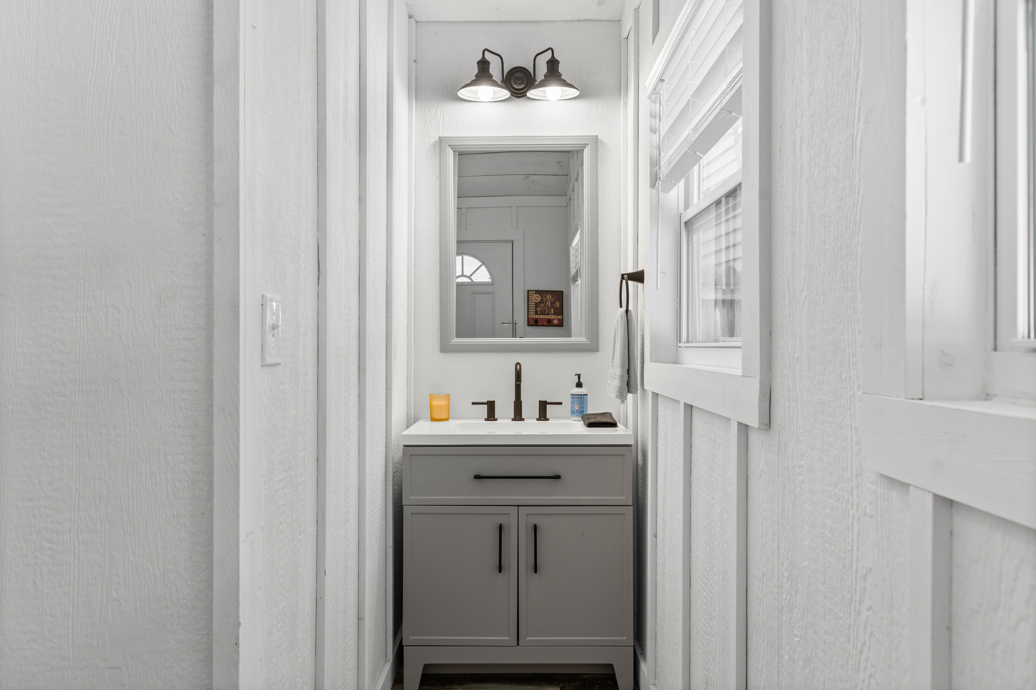 Fresh, clean, and thoughtfully updated, the guest cottage's full bathroom offers comfort and convenience.