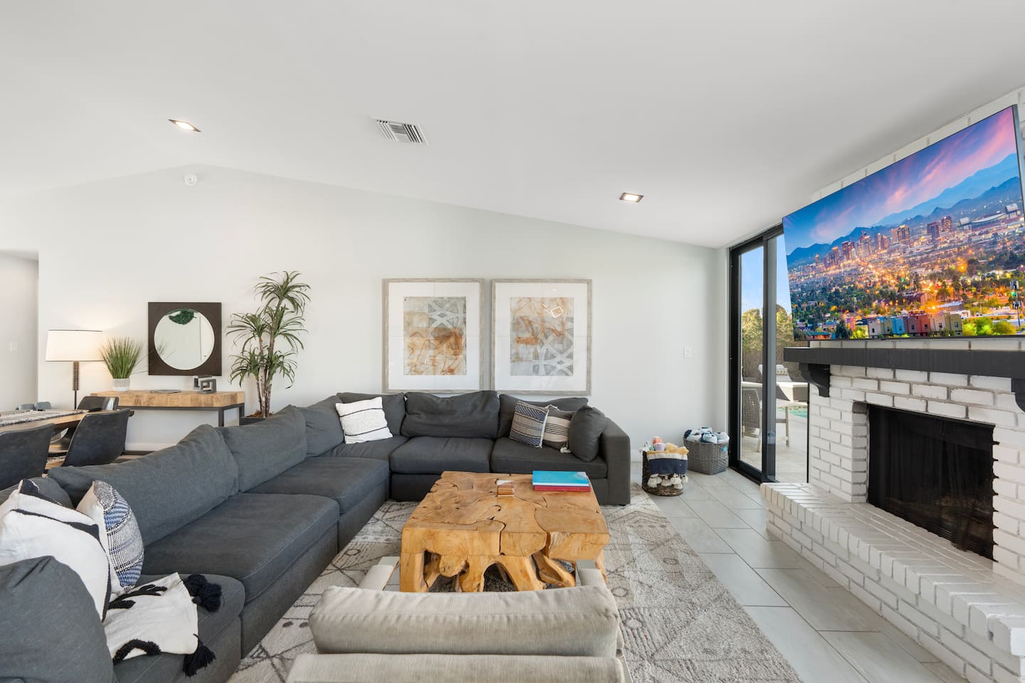 Cozy and spacious living area featuring a TV for entertainment.