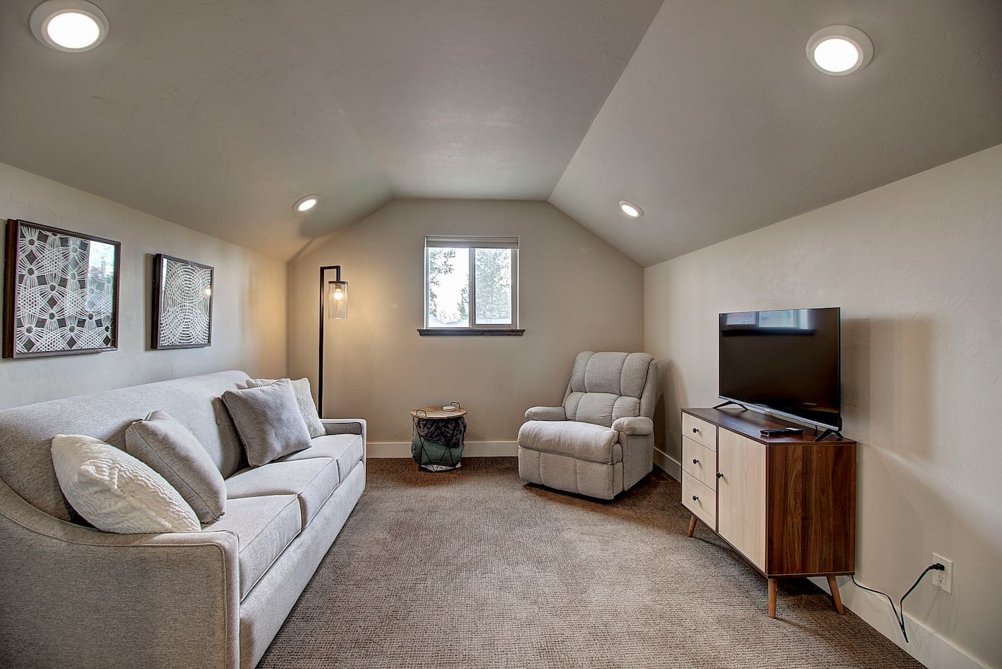 A comfy sofa and recliner make this cozy upstairs hangout perfect for catching a show or just kicking back after a day of exploring.