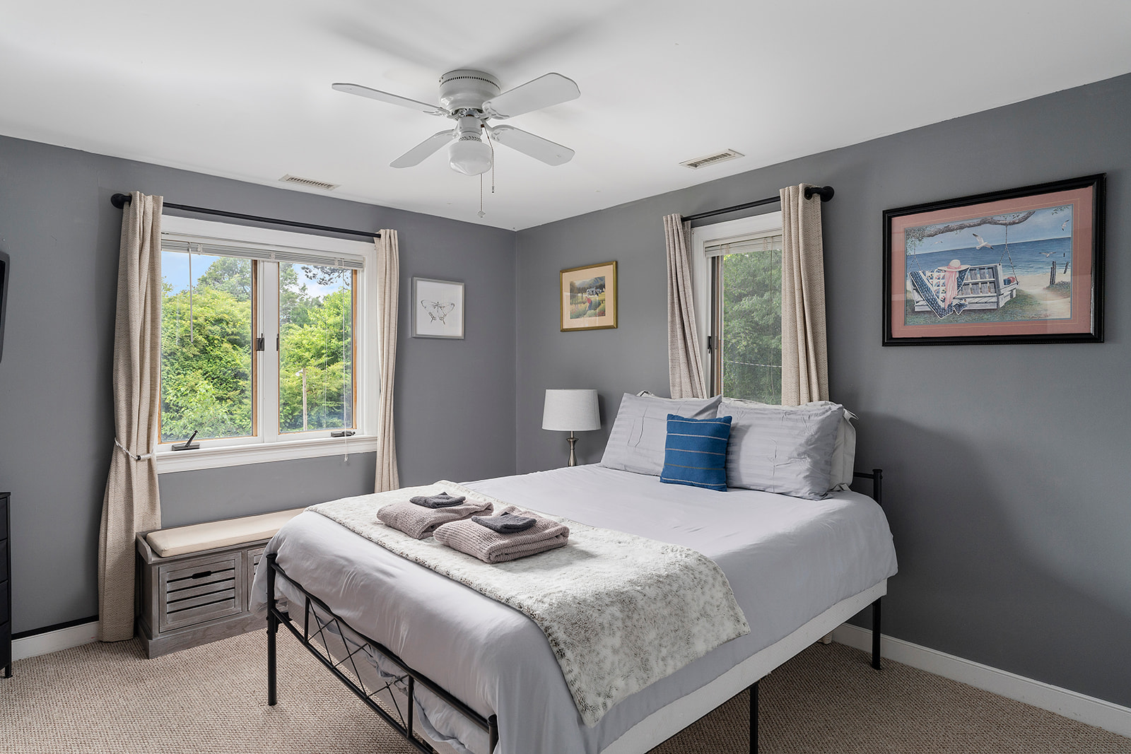 Queen Bedroom 2: Bright room with scenic views, plush bedding, and unique artwork awaits you!