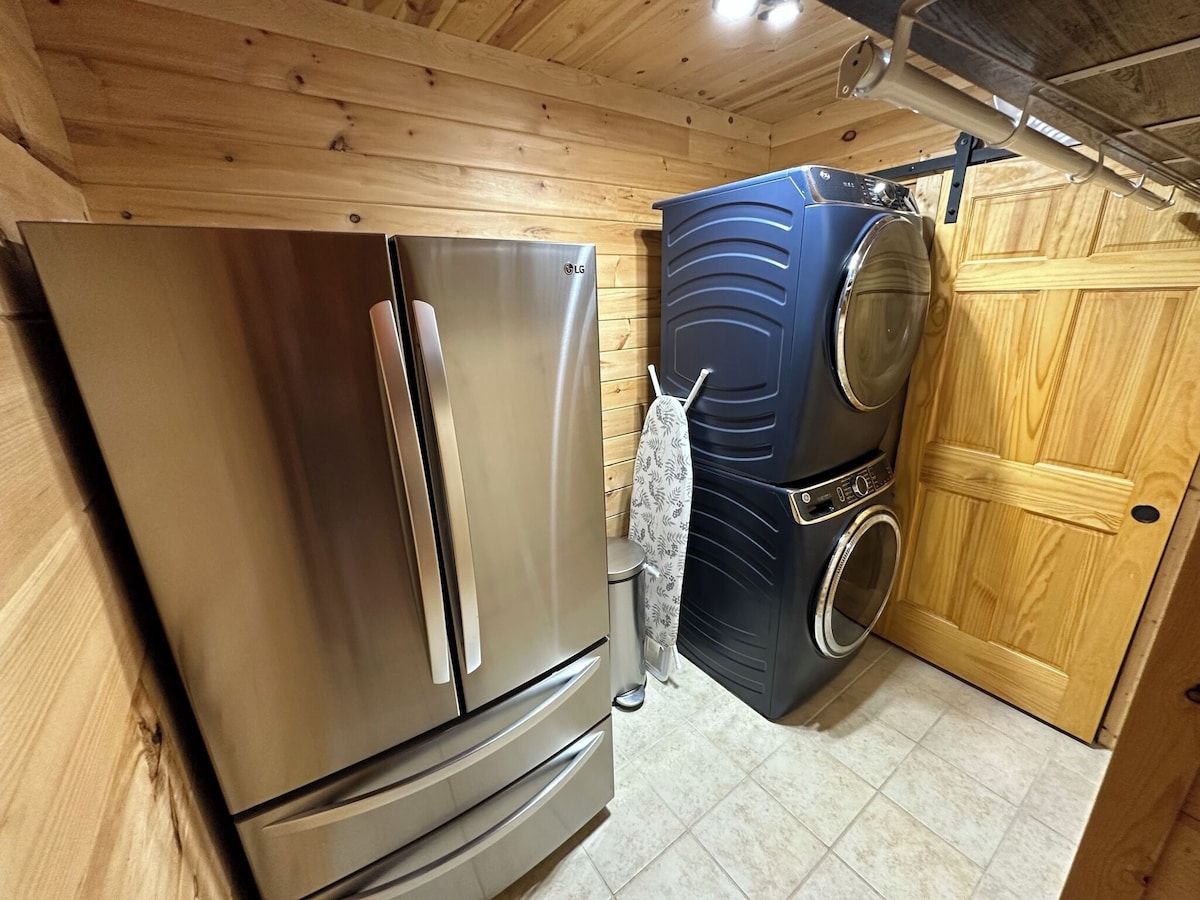 Laundry room has 2 very large front load top of the line GE washer and dryer as well as a 2nd refrigerator/freezer for storing extra food that did not fit in the 1st refrigerator/freezer in the kitchen 