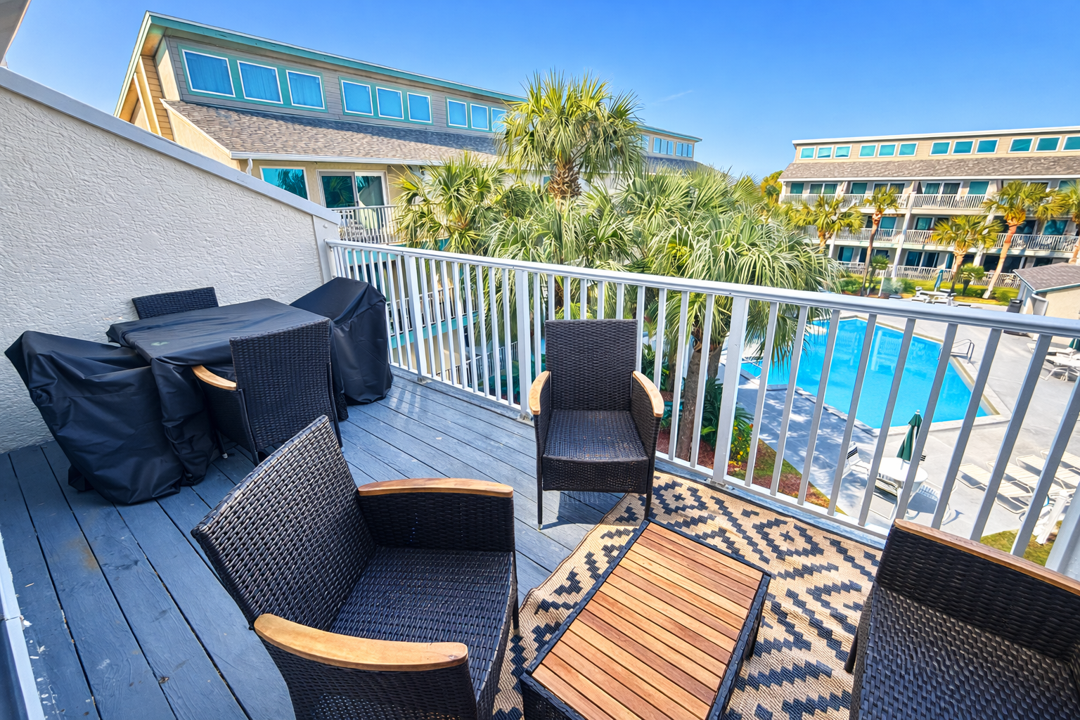 Spacious balcony overlooking pool area!