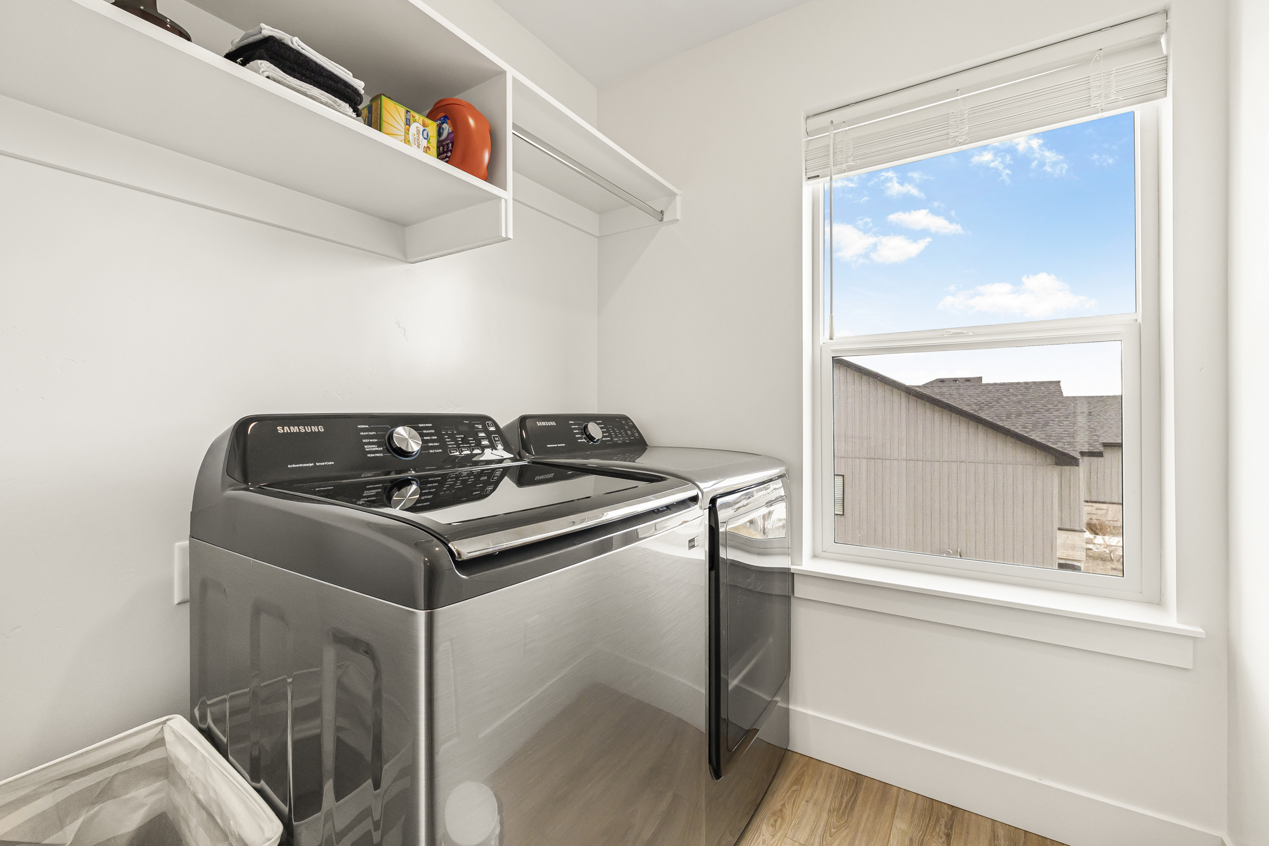 Laundry room with access to washer and dryer.