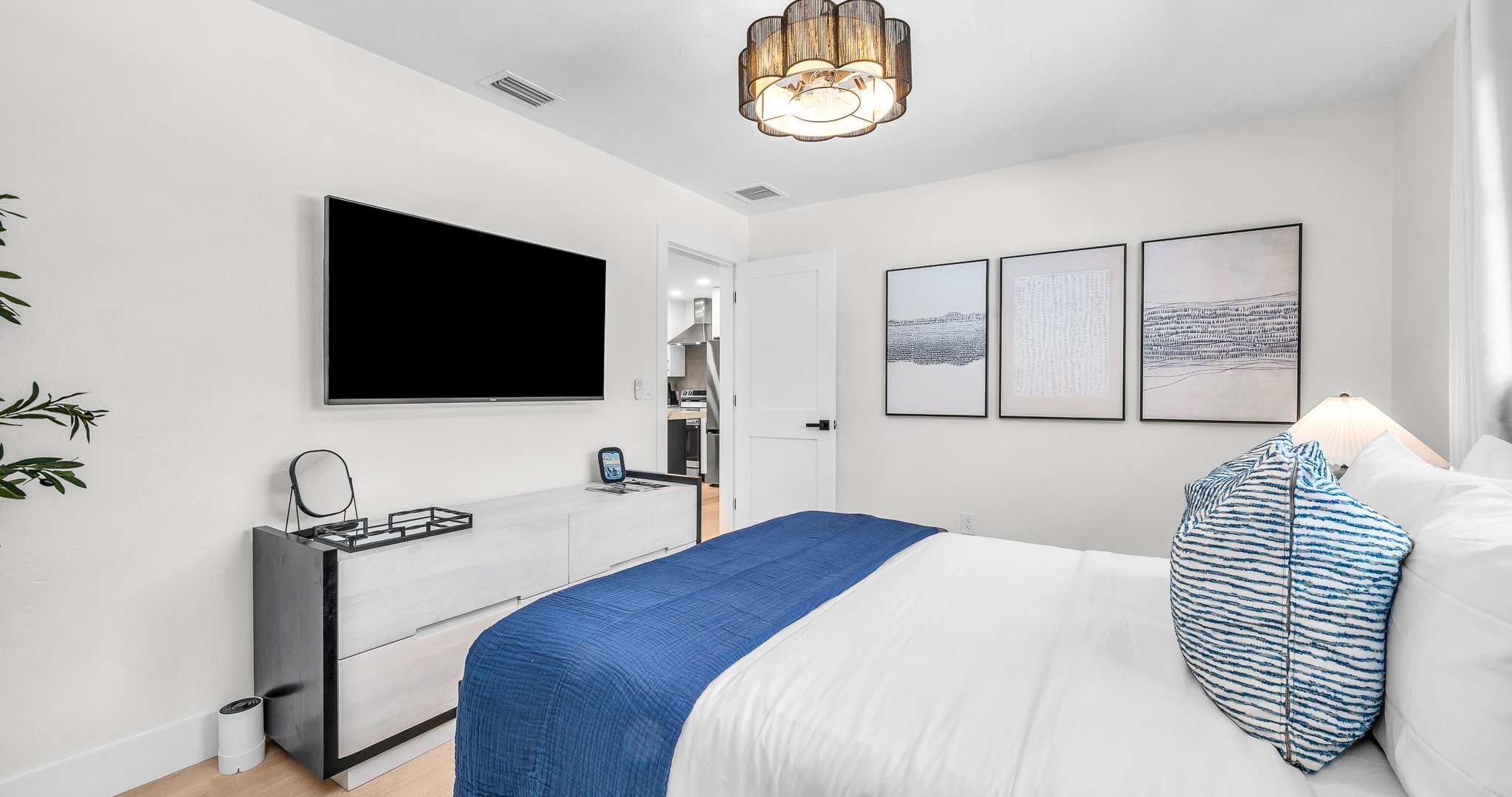 Designed for both style and comfort, this queen retreat blends chic coastal décor with sleek modern touches. With loads of closet space and a Smart TV for streaming, it’s perfect for unwinding after a day at the beach.
