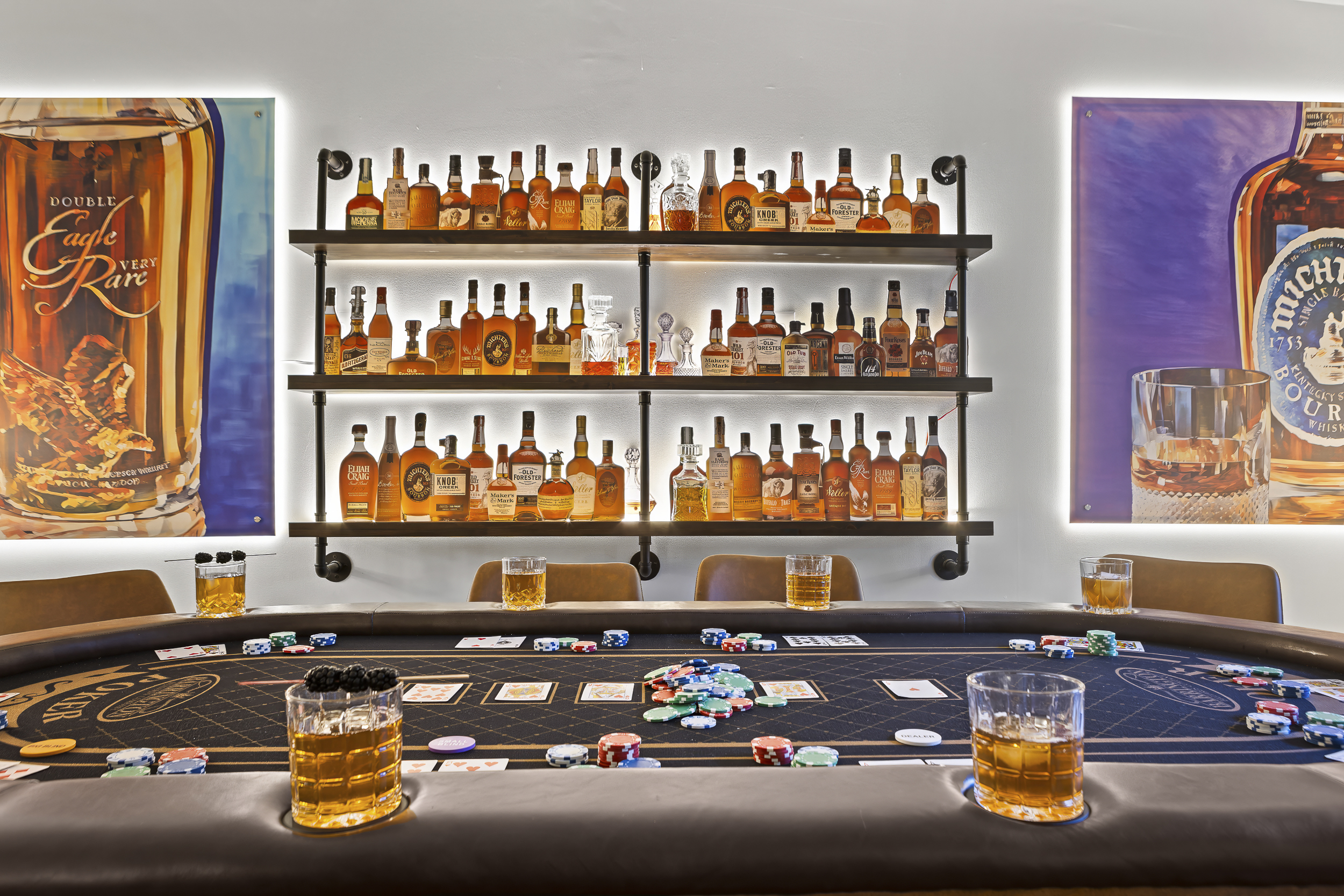 Deal in at the tournament-style poker table with 60+ bottles of bourbon keeping watch from the shelves behind.