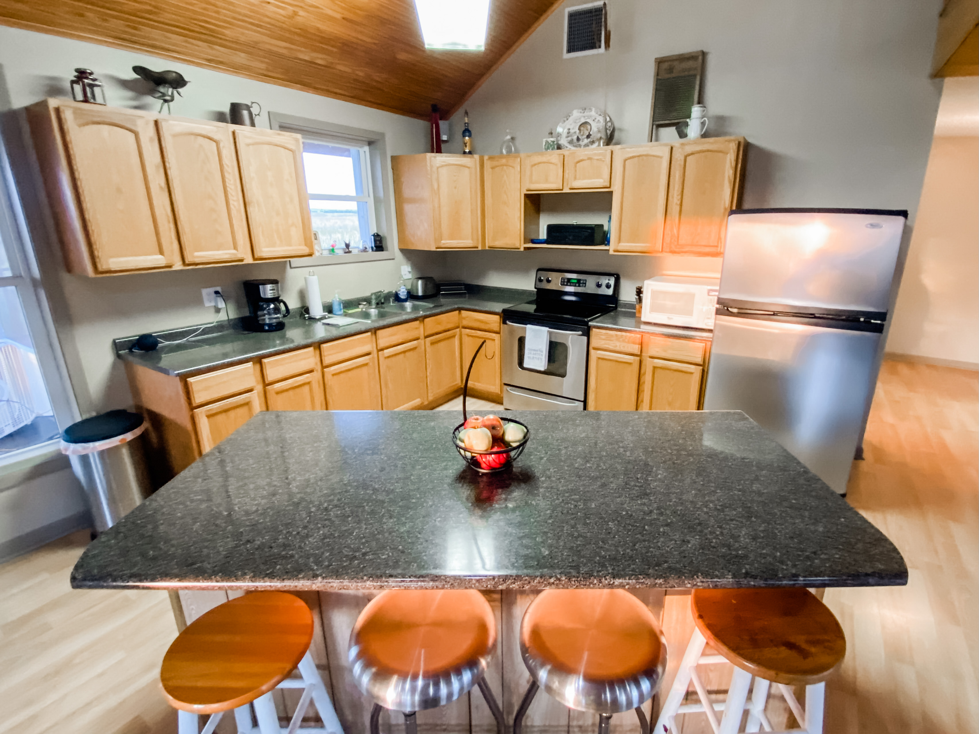 Fully stocked kitchen including microwave and coffee pot.  Ice maker in freezer.