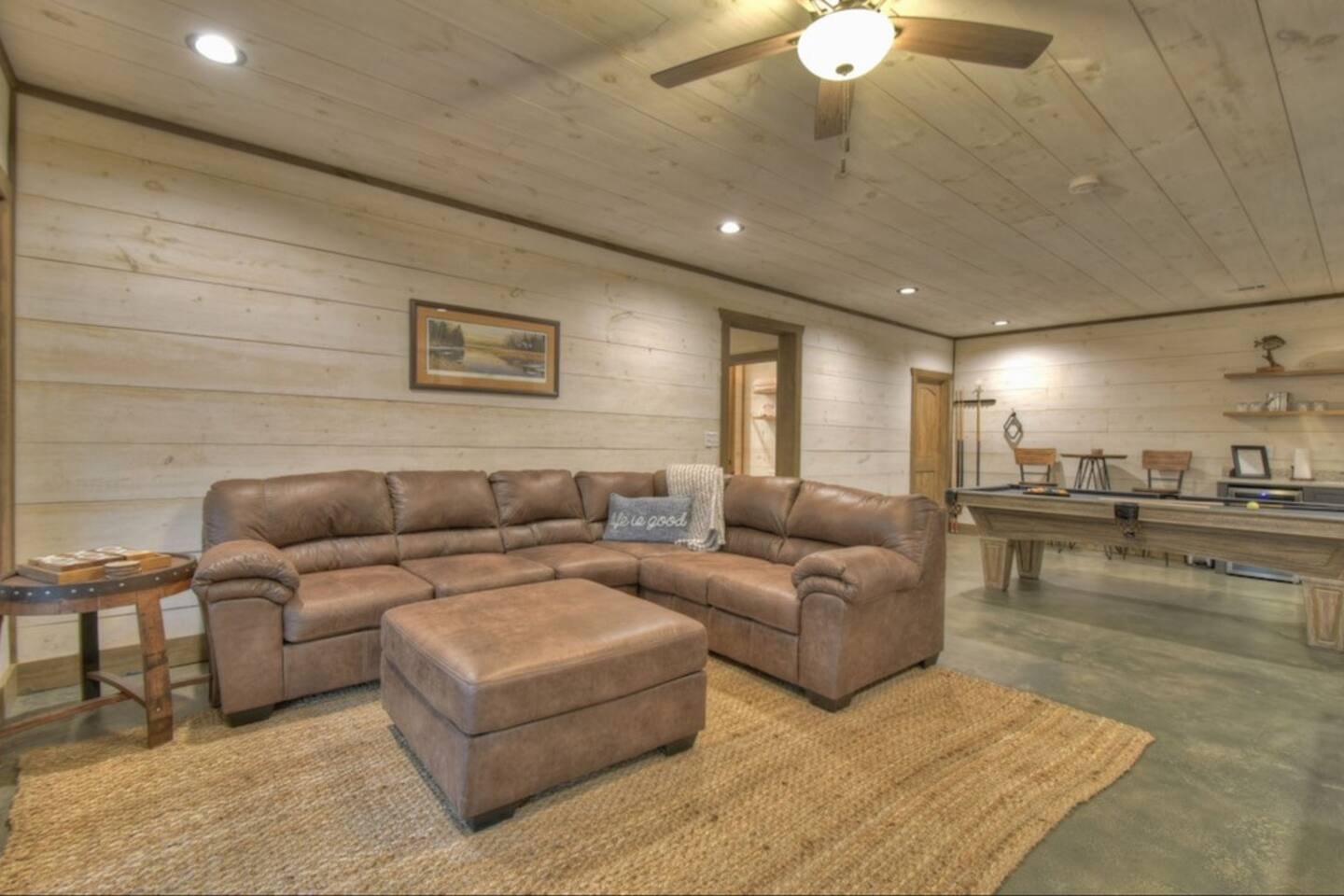 Another view of our game room and sectional.  Foot stool is big enough to push in near couch to make an extra sleeping space.