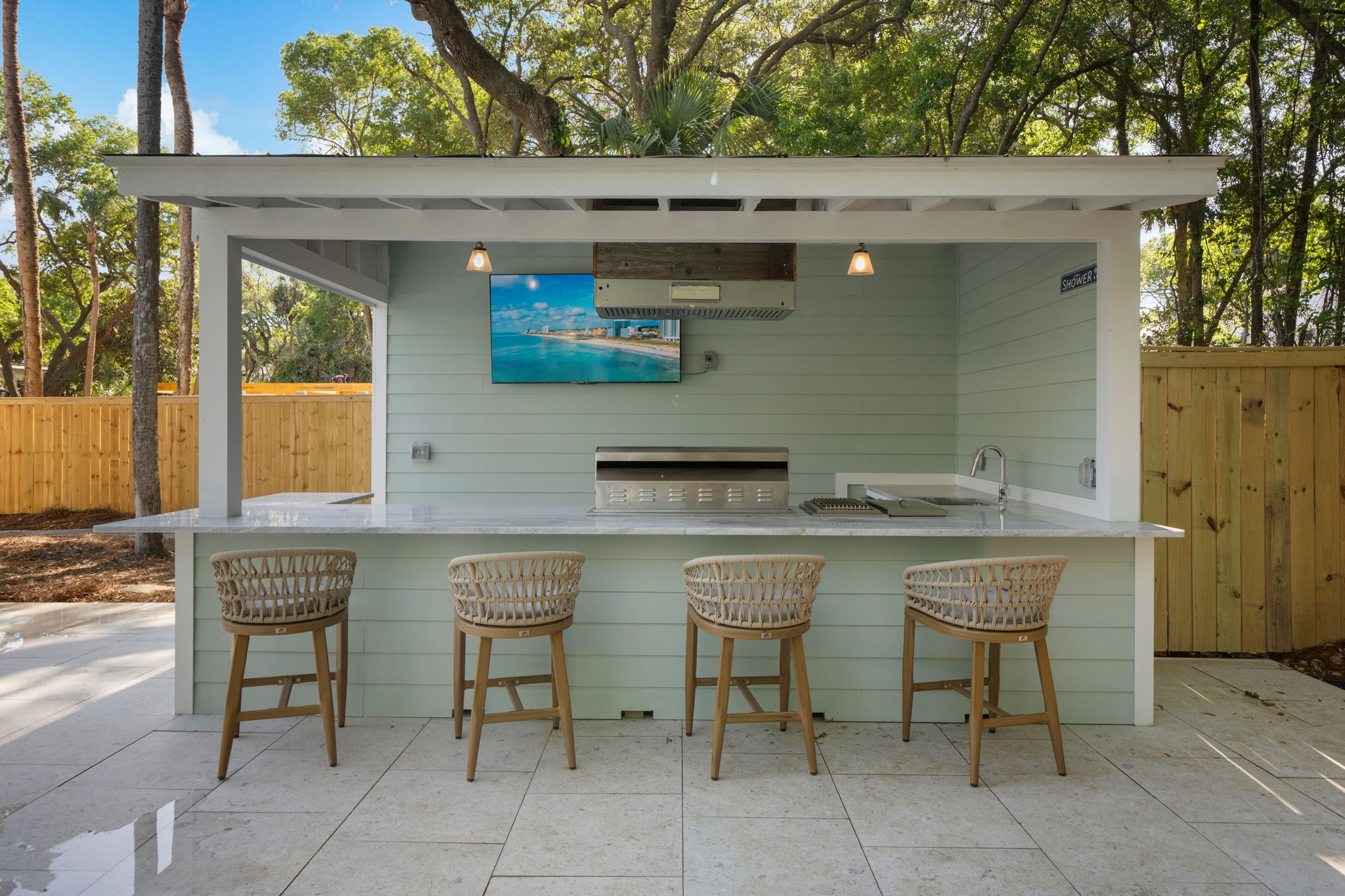 Outdoor Kitchen And Bar With Gourmet Grill, Beer and Wine Fridge, Ice Maker, and 65" Smart TV | IOP Escapes Beach Blessing | 3705 Hartnett Blvd, Isle of Palms, SC