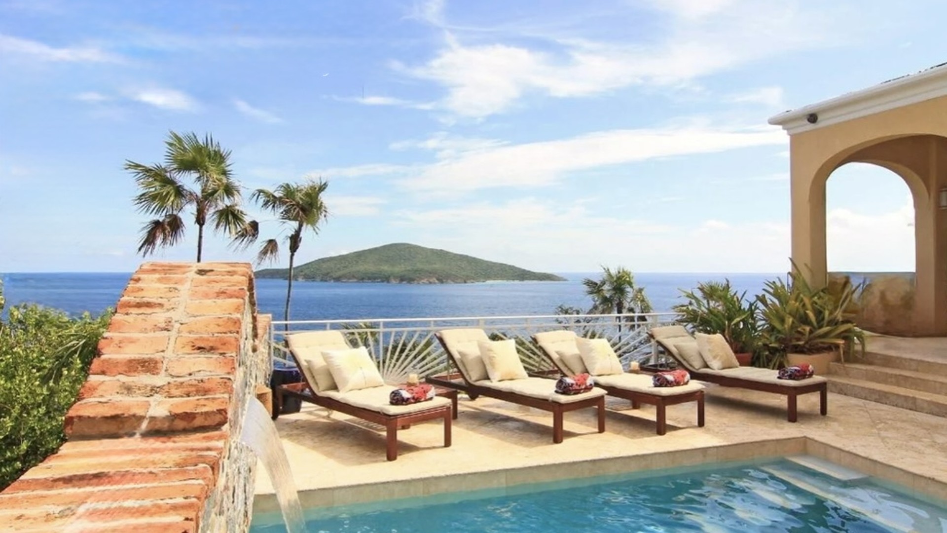 Private pool with loungers and sweeping Atlantic views—your front-row seat to Hans Lollik.