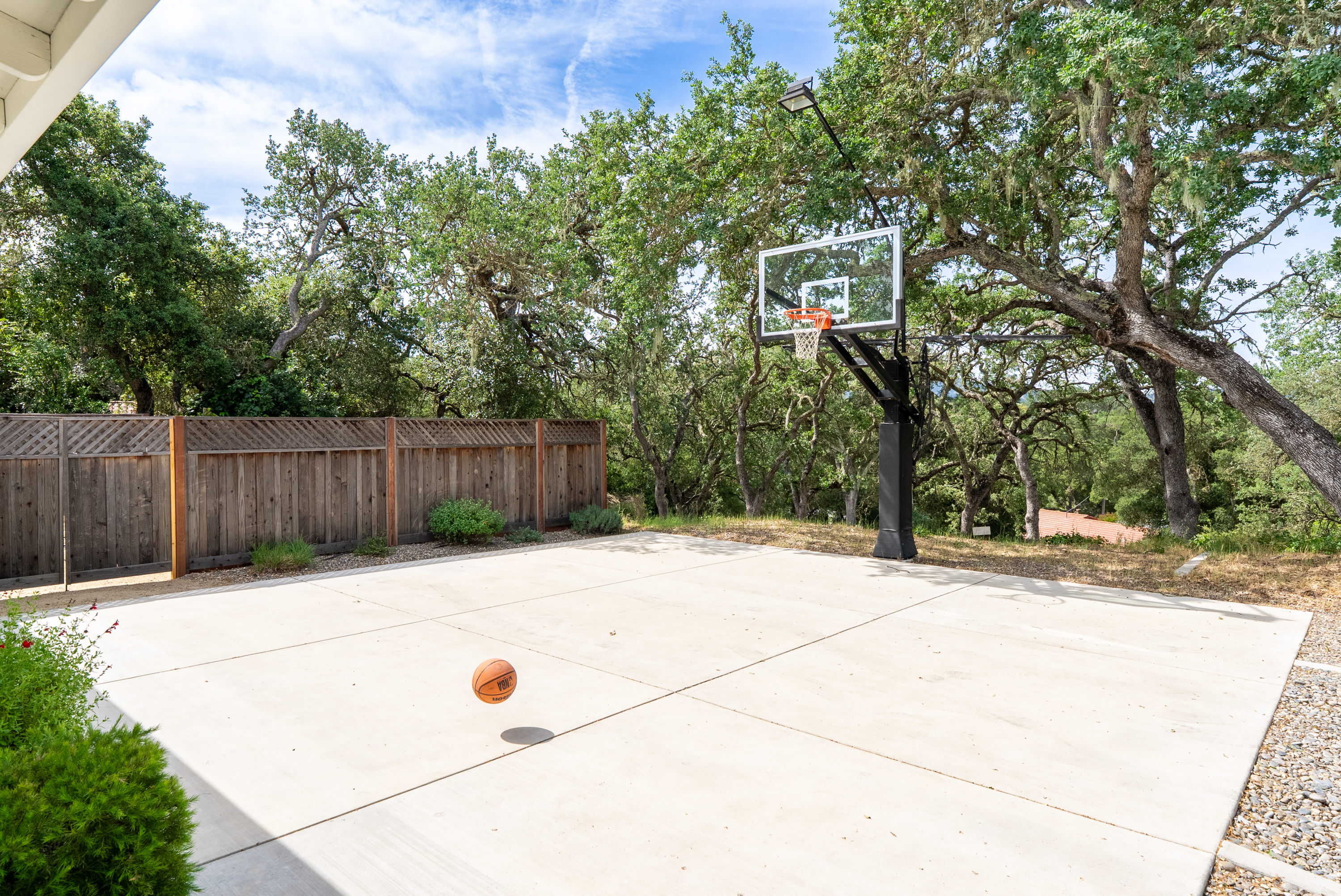 Shoot some hoops on this private court while the sun dips below the hills.