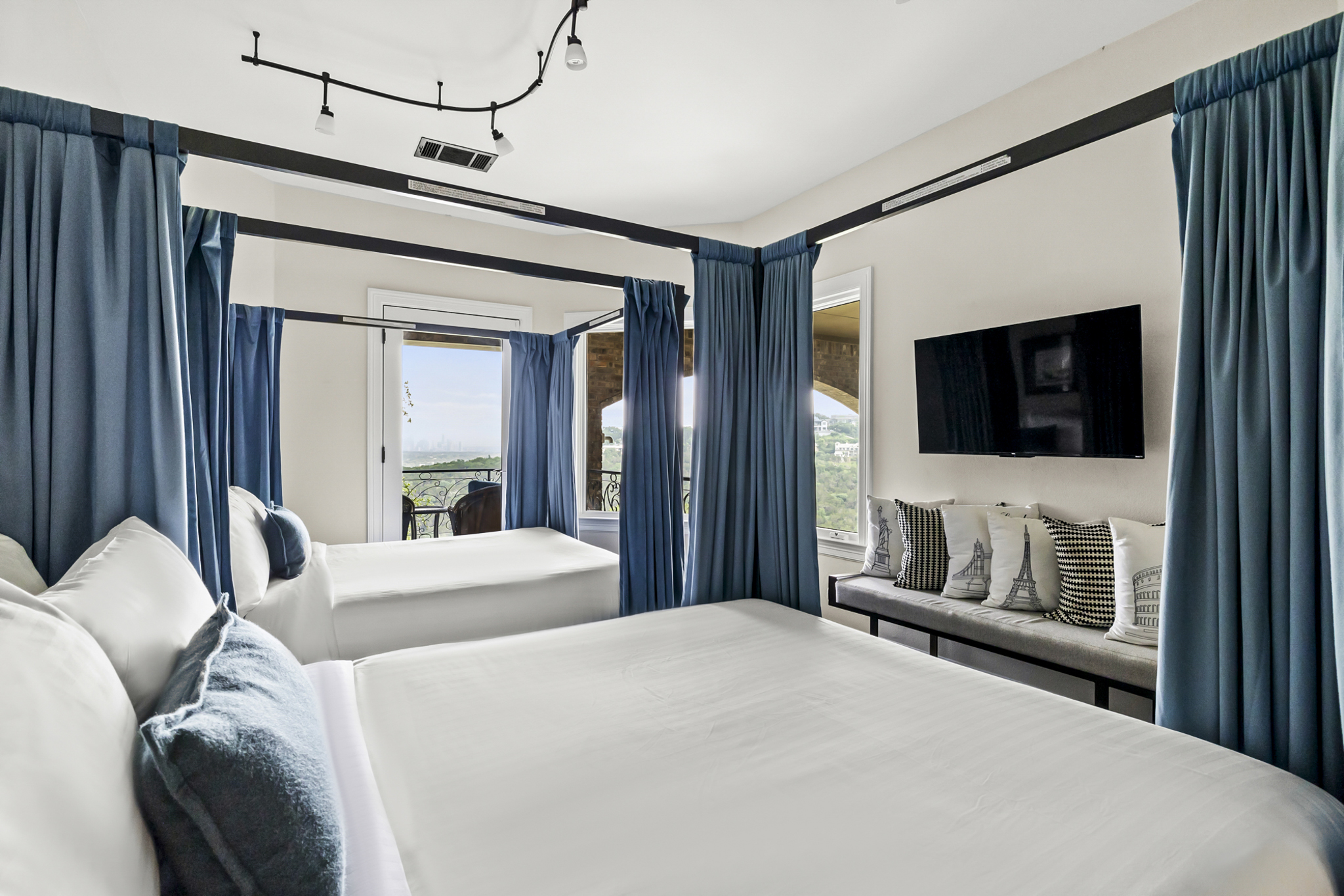 Bedroom 6 - 2 Queen beds with privacy curtains. Located upstairs with a private balcony facing the downtown skyline.