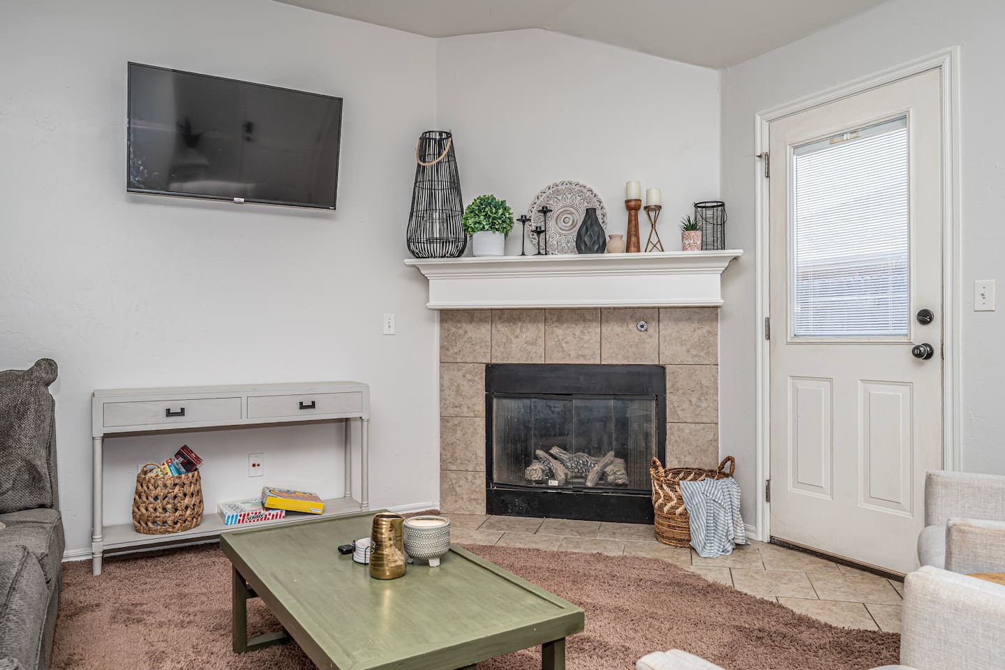 Inviting living room with smart TV, fireplace, and plenty of comfort.