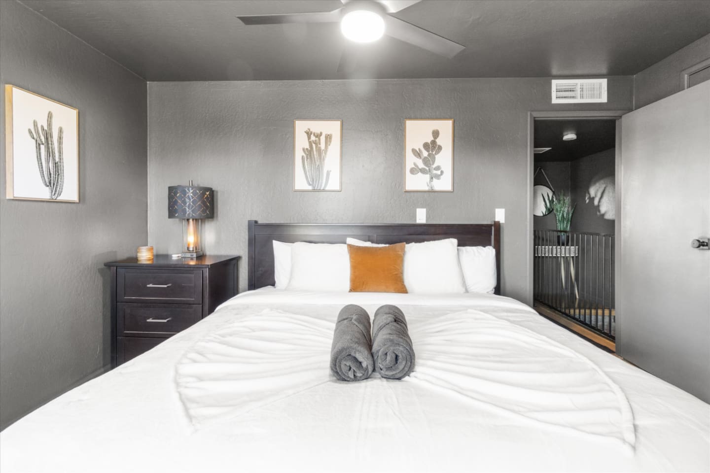 King bedroom with soft linens, bedside lighting, and a calm place to rest.