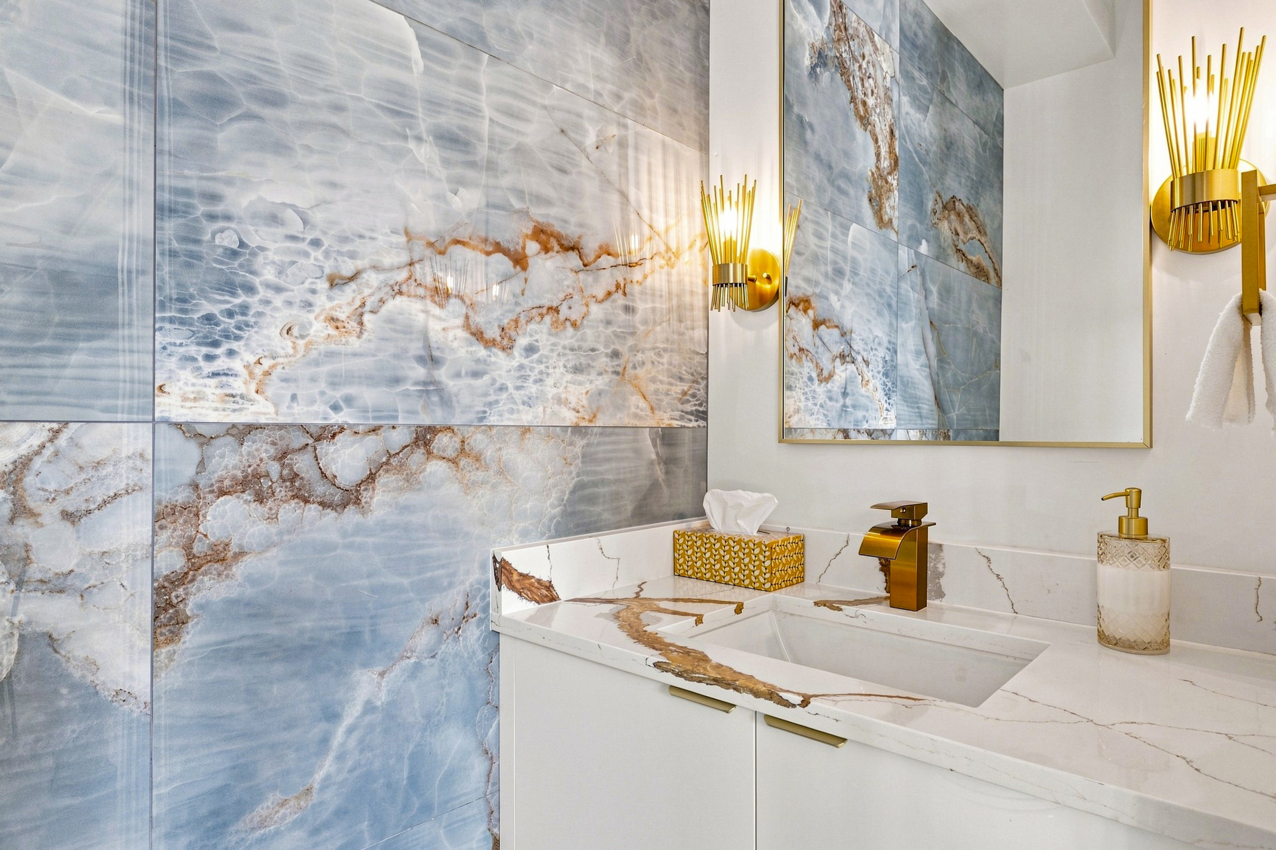 Indulge in luxury with stunning marble accents and chic lighting!

