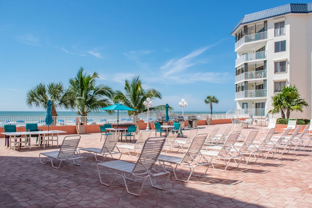 Heated Pool & Hot Tub open year round with ample seating, overlooking Gulf of Mexico.