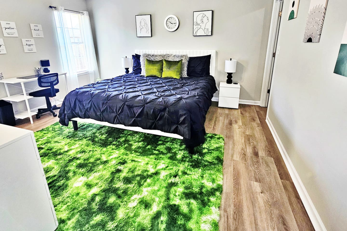 Relax in this modern-style bedroom. There is a king bed along with a flat-screen smart TV. 