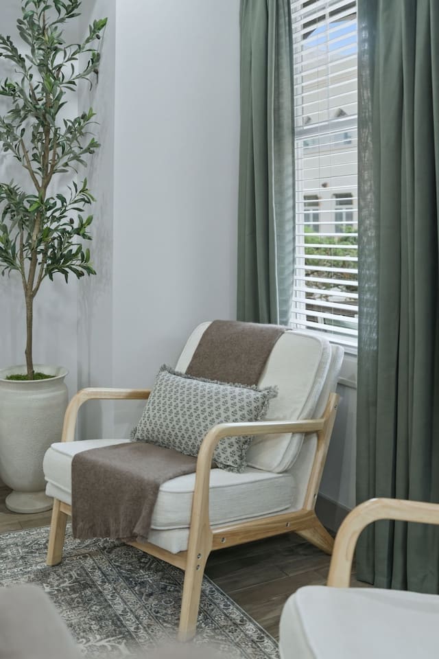 Another view of the inviting lounge chair by the window—an ideal spot to sit back, relax, and enjoy the peaceful atmosphere.
