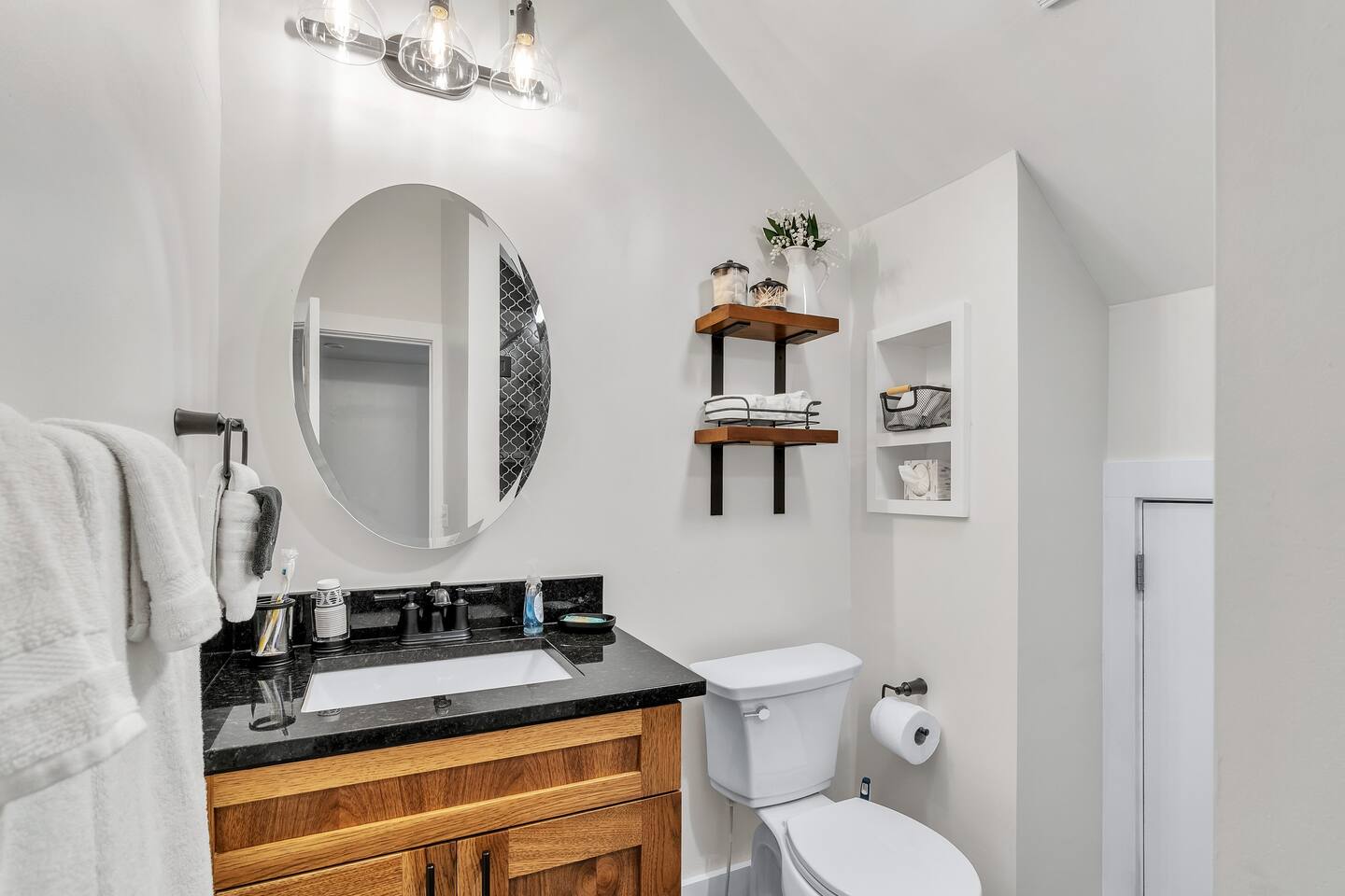 Beautiful Top-level full bathroom with vaulted ceilings and walk in shower.