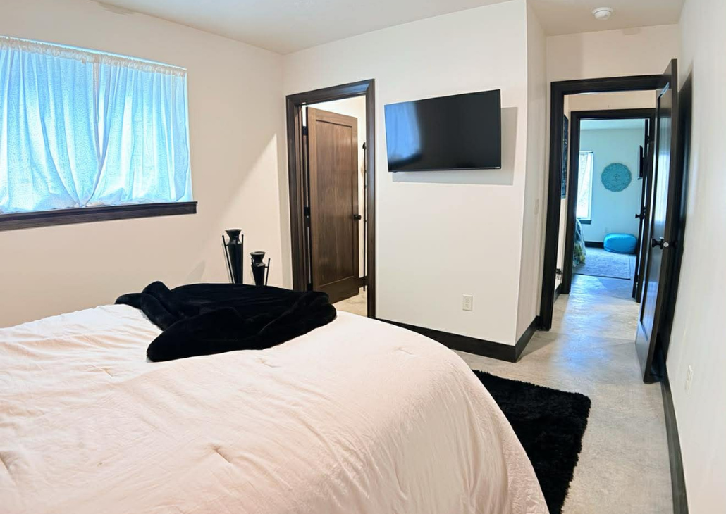 Bedroom 1 with a tv in it.