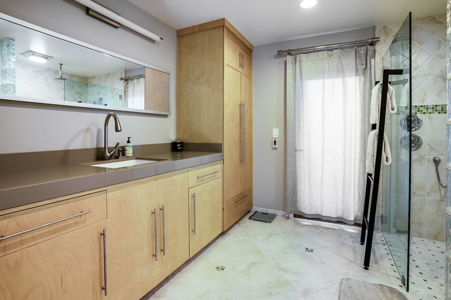 Primary bathroom with walk-in shower.