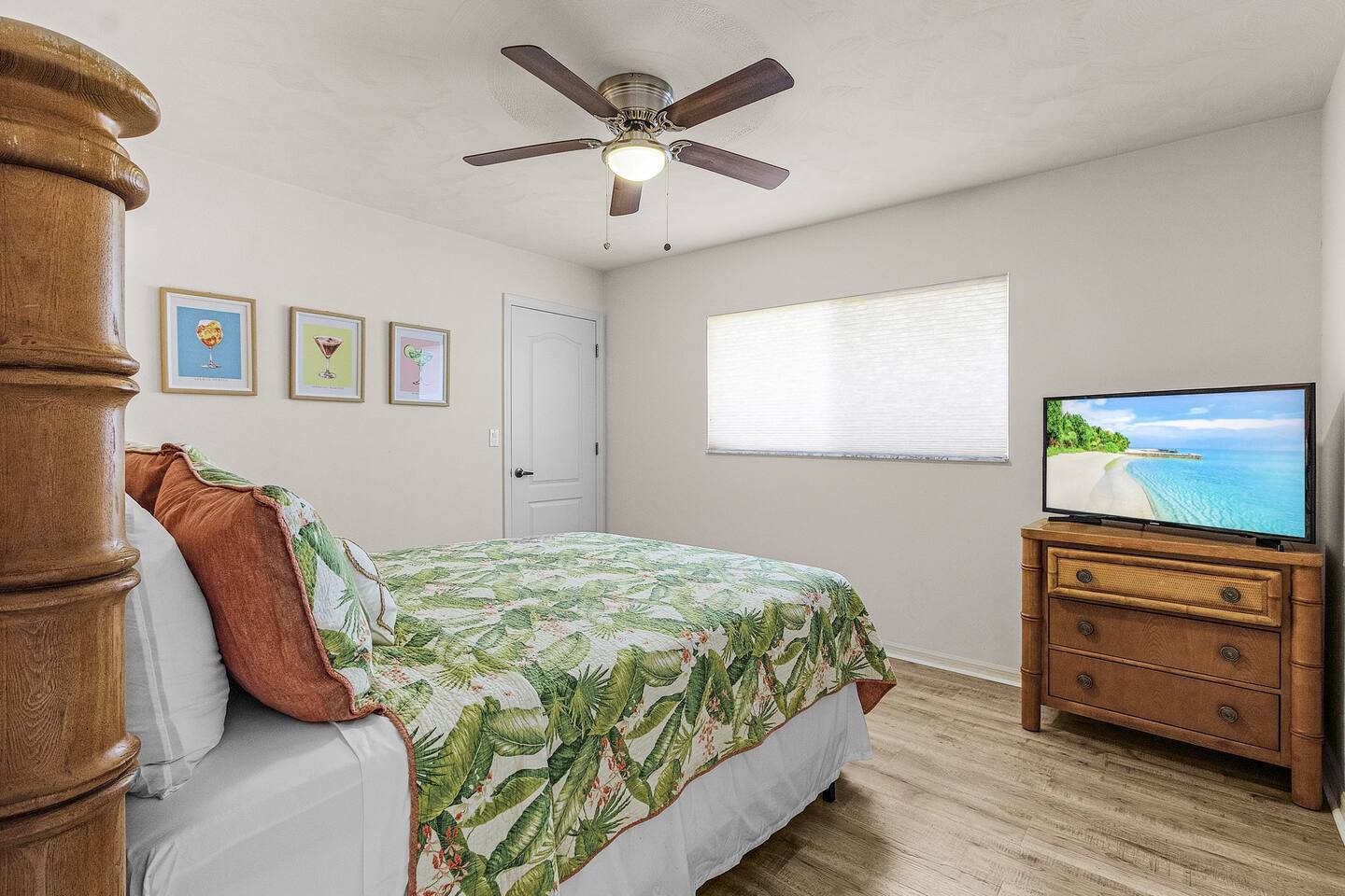 First guest bedroom with a cozy queen bed and flat-screen TV for added comfort!