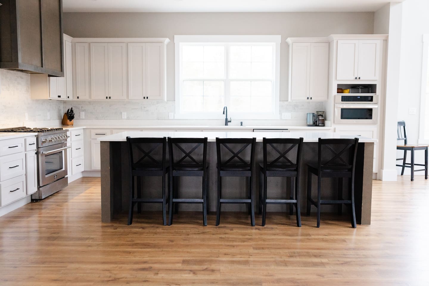 Island seats 5 with an additional two stools in the dining area. Kitchen table upgrade coming soon to accommodate even more guests. Plenty of pantry space, kitchen appliances, dishes, mugs, etc. 