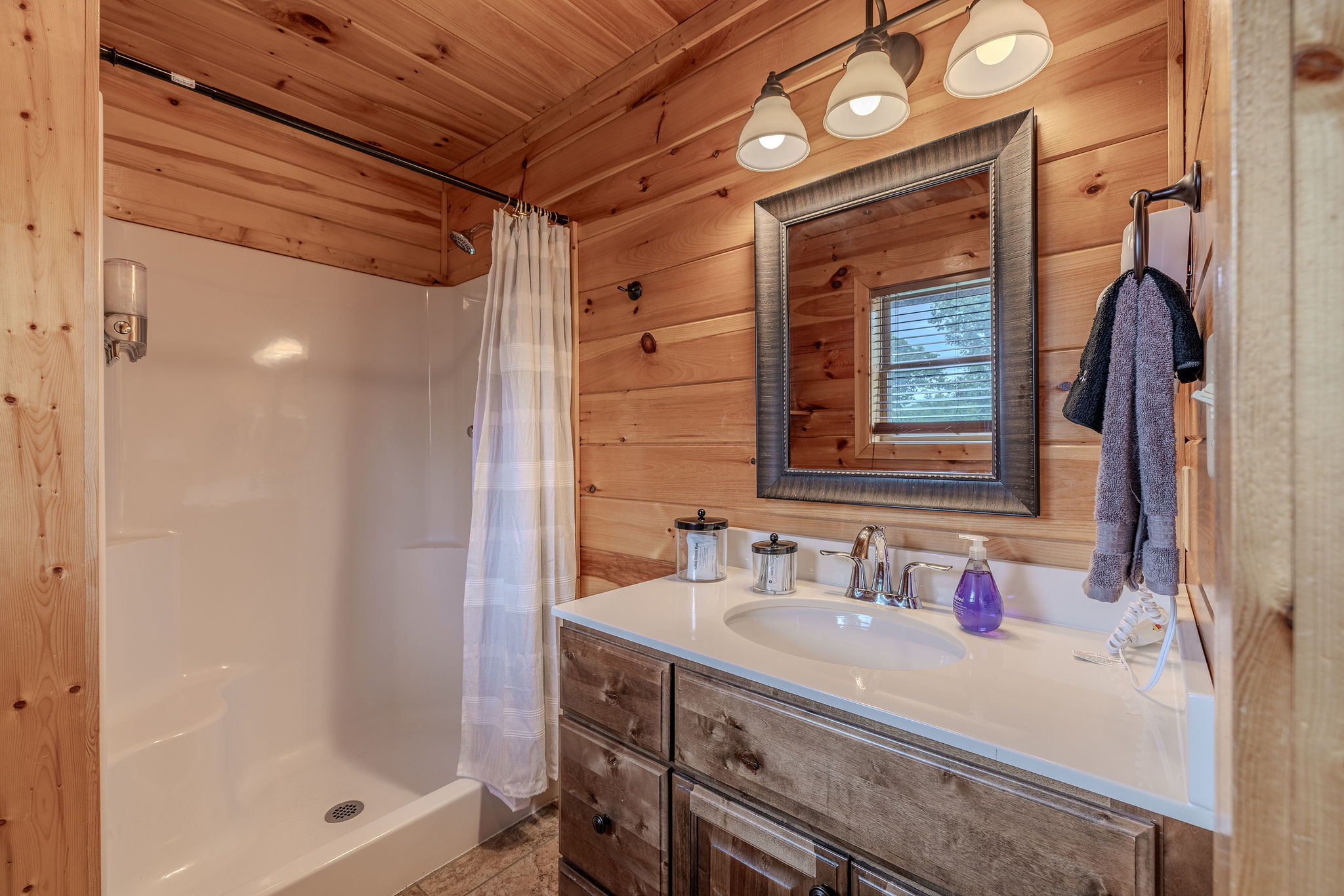 The Acoustic Suite Ensuite Bathroom adds private convenience to this upper-level king retreat, perfect for guests who want comfort and separation during a group stay.