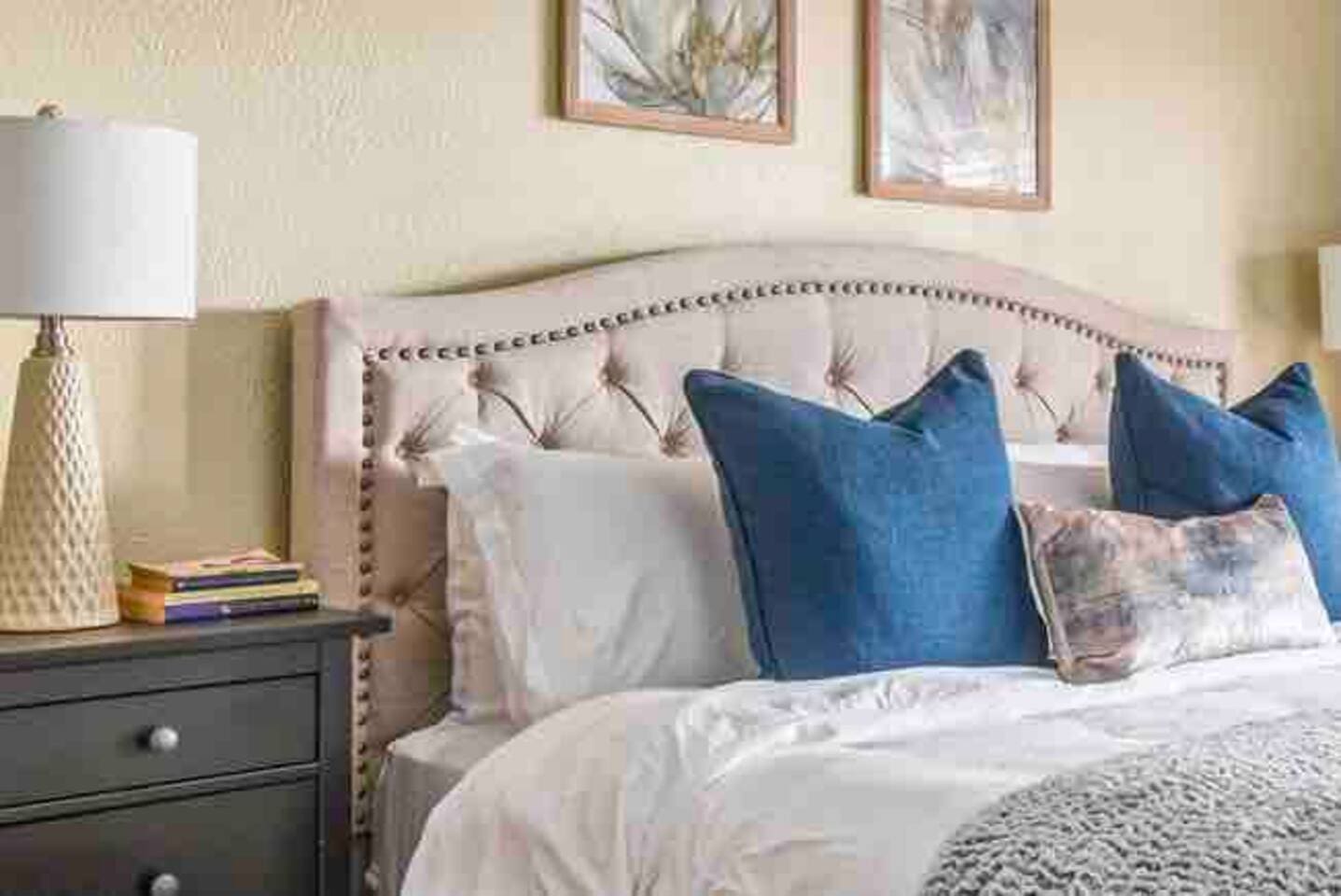 Primary bedroom with king bed, extra pillows, and  brand new comfortable mattress and linens. 