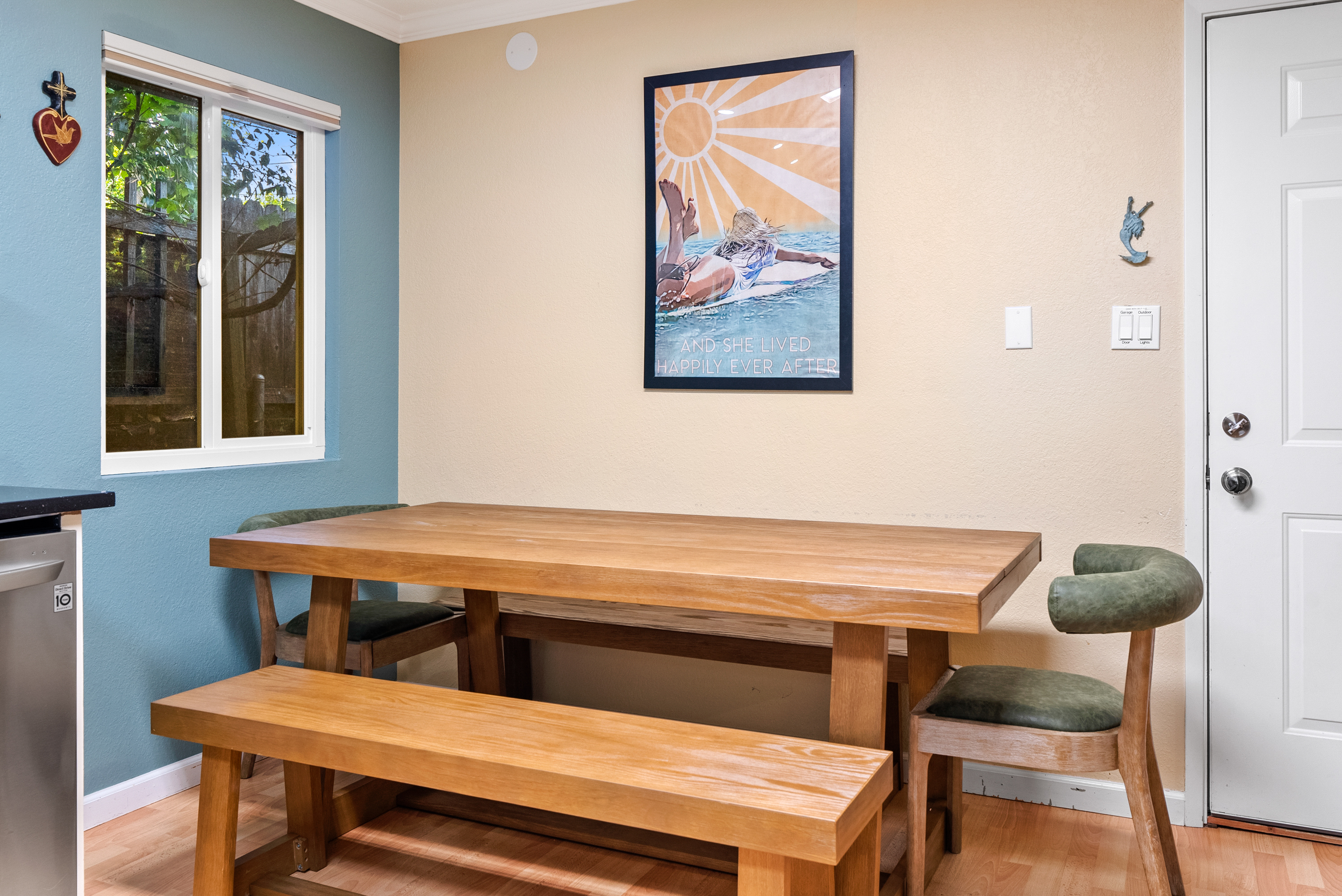 Gather around this spacious wooden table for shared meals.