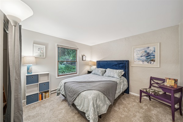 Enjoy a lovely night's stay in the queen bed in this artsy lower bedroom.