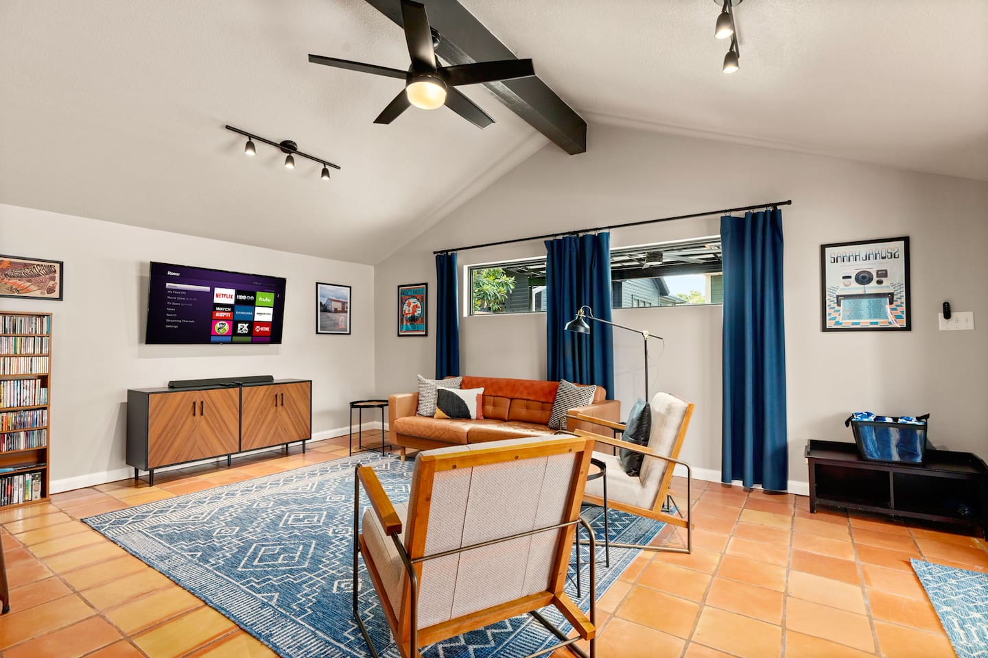 Living area: Love seat, couch, and 50 inch Smart TV with DVD player