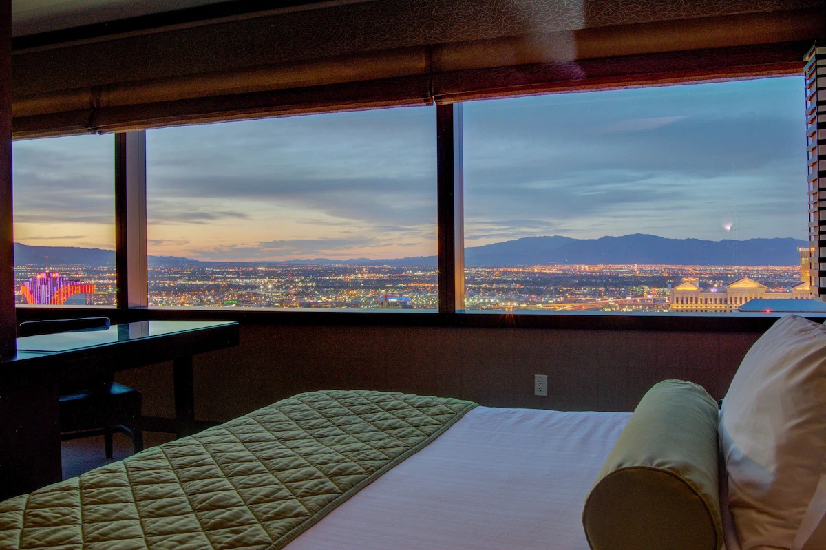 Gaze out at dazzling city lights every night right from your suite 🌃 
