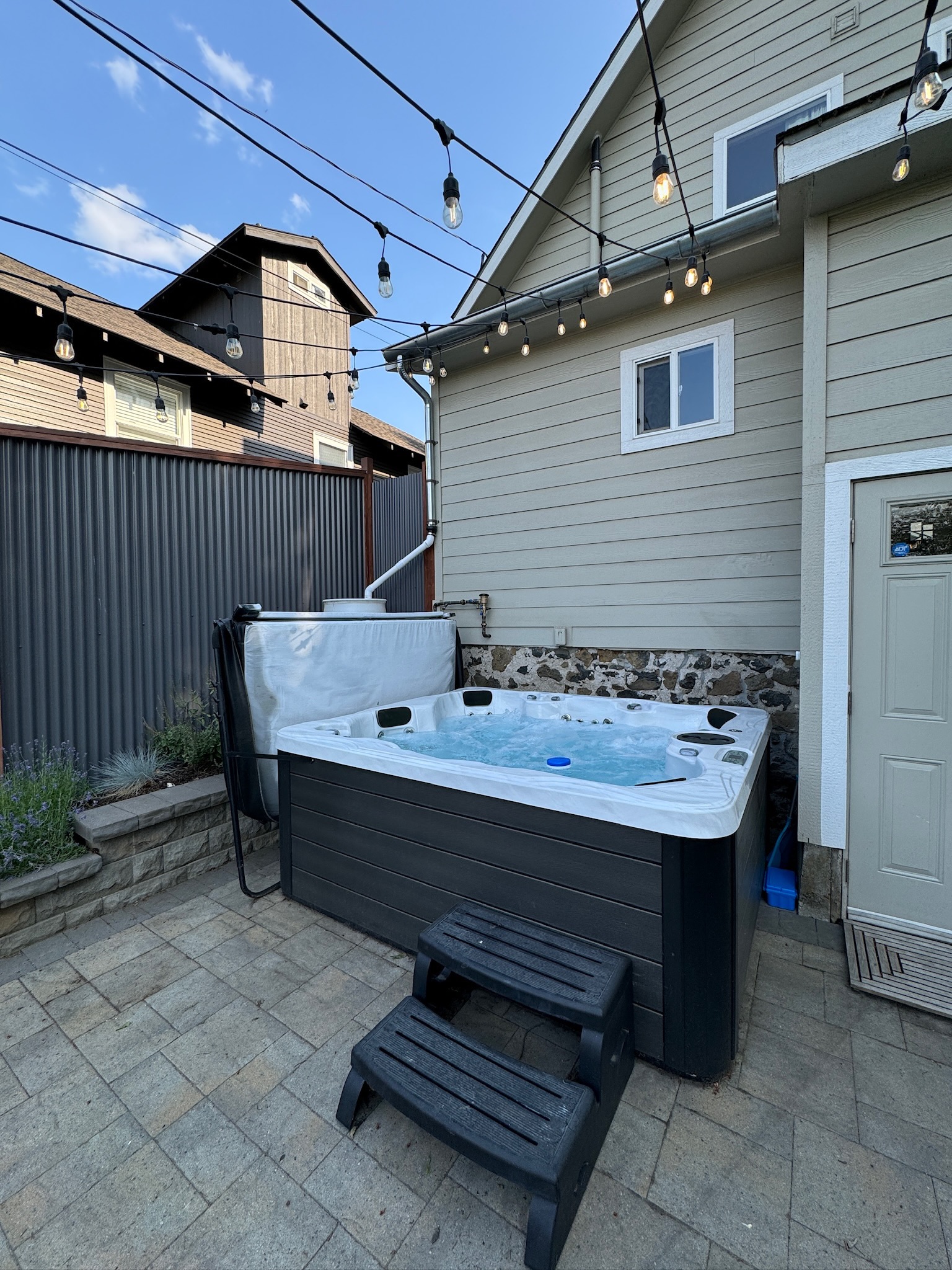 Enjoy dining outdoors on the patio in the fully fenced backyard. Then soak in the hot tub for maximum relaxation!