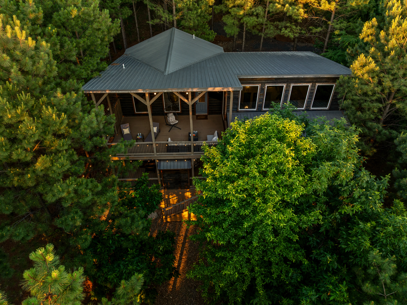 Nestled among towering pines, this secluded luxury cabin offers the perfect blend of privacy and comfort, featuring a spacious covered deck, peaceful forest views, and a true escape into nature. 🌲✨🏡