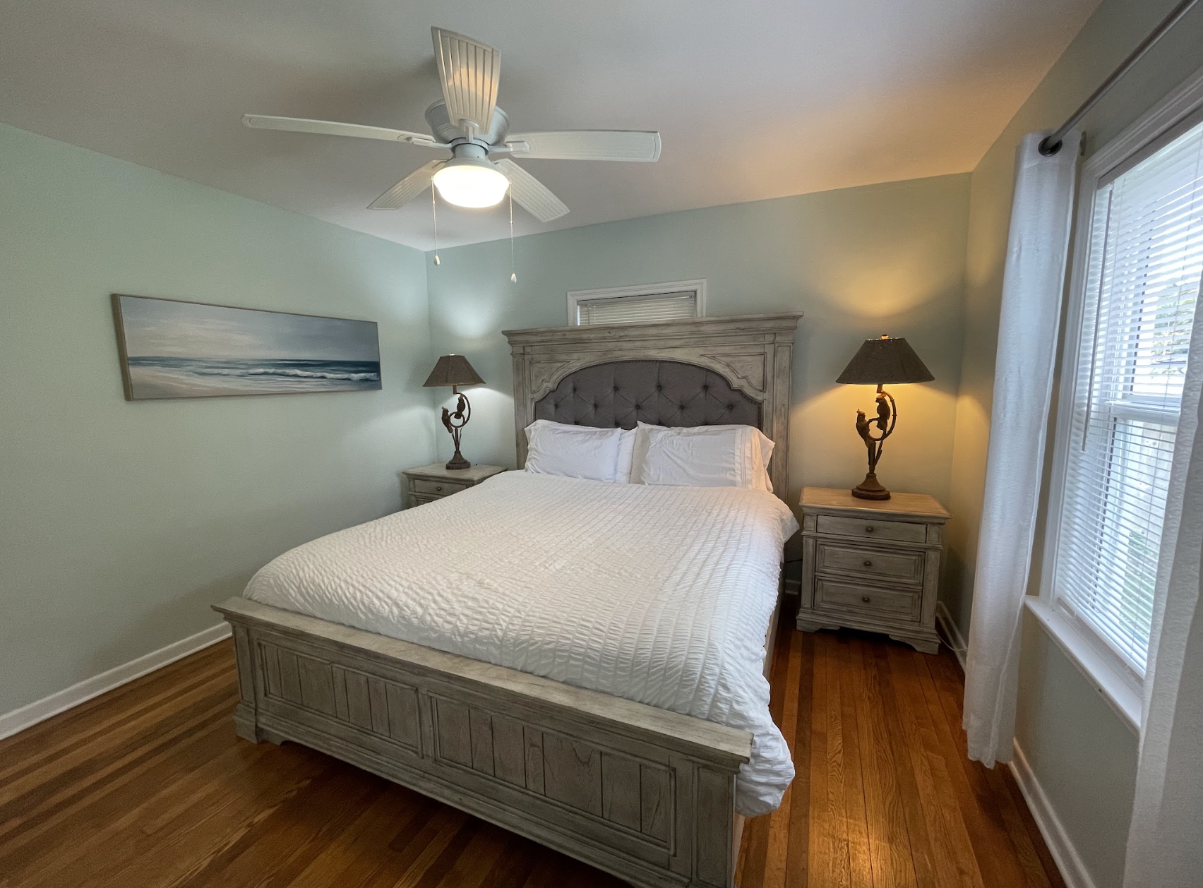 The first bedroom features a comfortable king-sized bed, facing the backyard. It also comes with an ensuite bathroom.