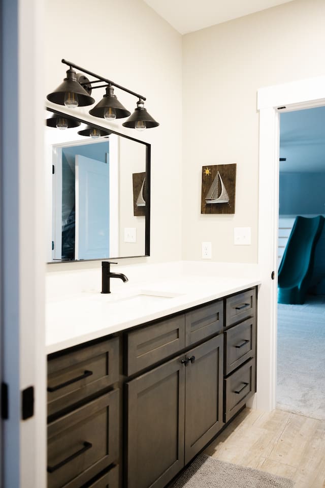 Private sink area for bedroom #2, which connects via sliding doors to private toilet room and private shower room (shared with bedroom #3). 