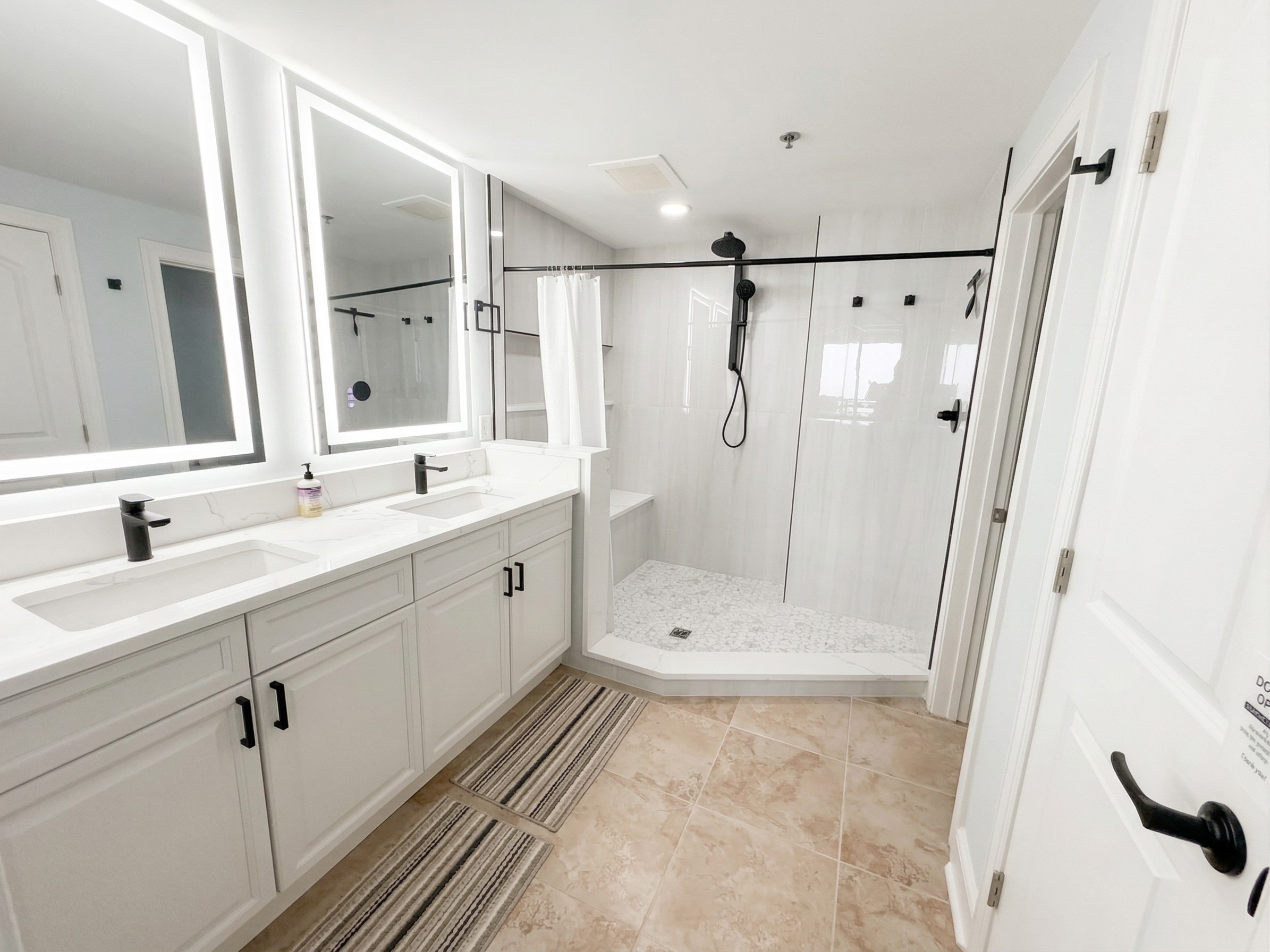 Start your day with plenty of space—double sinks, bright lighting, and a large walk-in tiled shower make mornings easy for everyone.