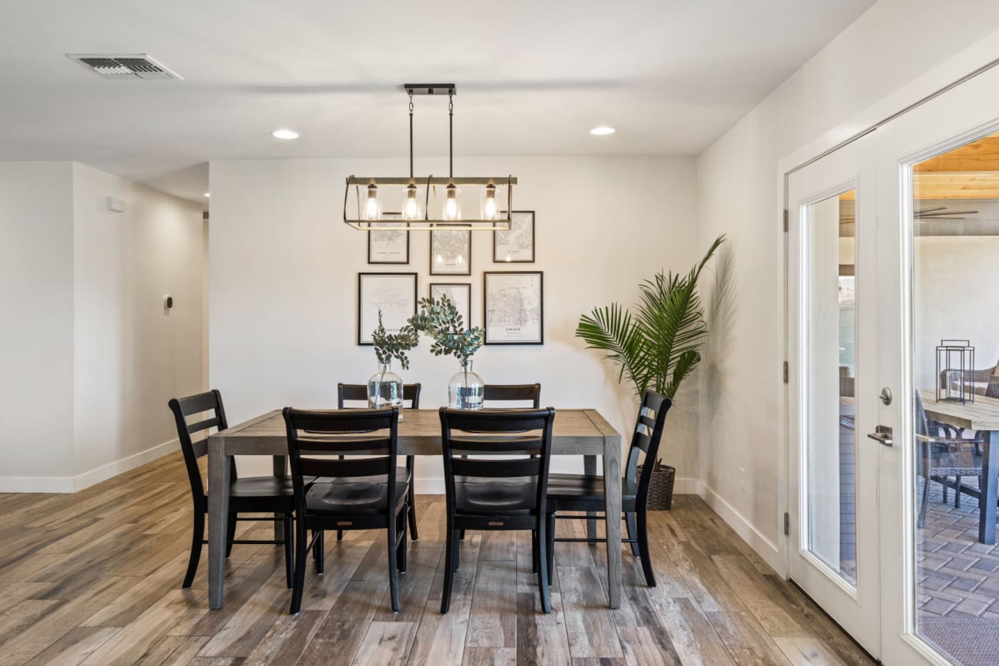Dining space with seating for shared meals, patio doors nearby, and open flow from the kitchen.