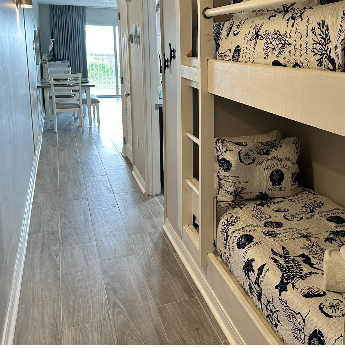 Built-in hallway bunks paired with stylish new tile