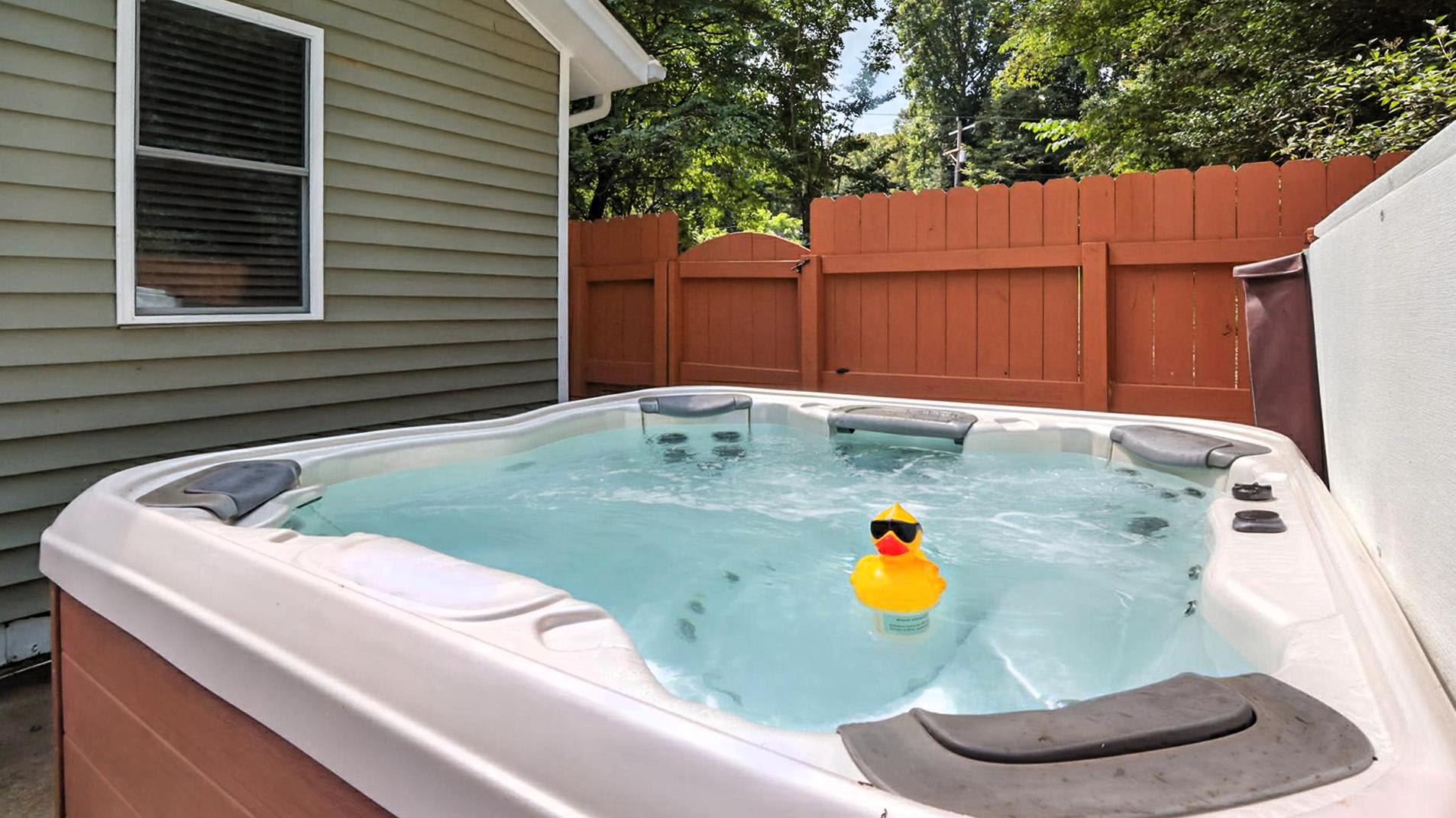 Hot Tub Retreat: Soak in relaxation with a charming view and playful vibes from our rubber duck!