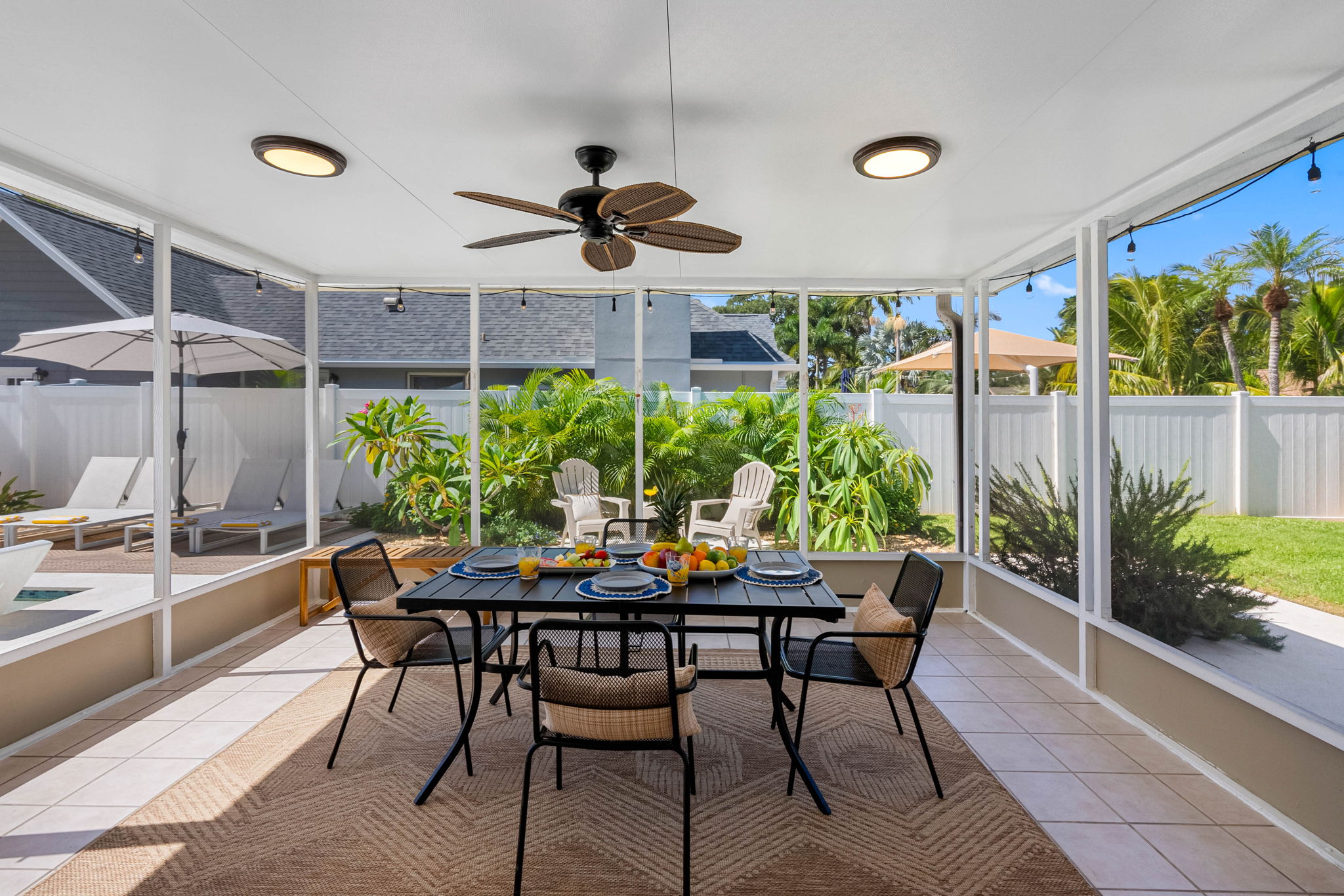 With chic patio furniture, lush greenery, and a crystal-clear heated pool, you won’t want to leave this backyard.