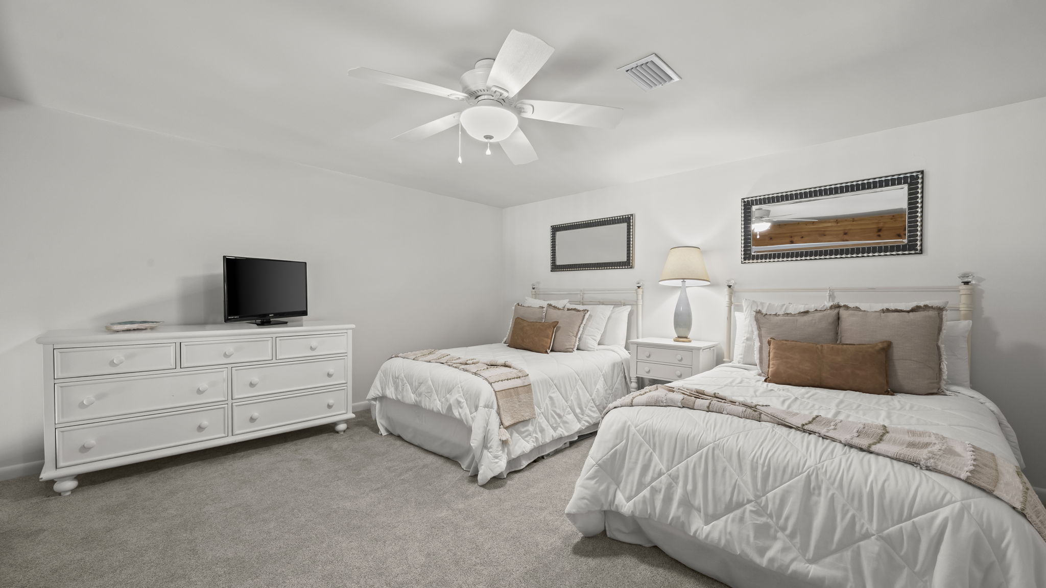 Spacious and inviting, the guest loft in our Cotton Bayou condo features two double beds, offering plenty of room for family or friends. This cozy retreat is perfect for relaxing after a day at the pool or exploring the bay.
