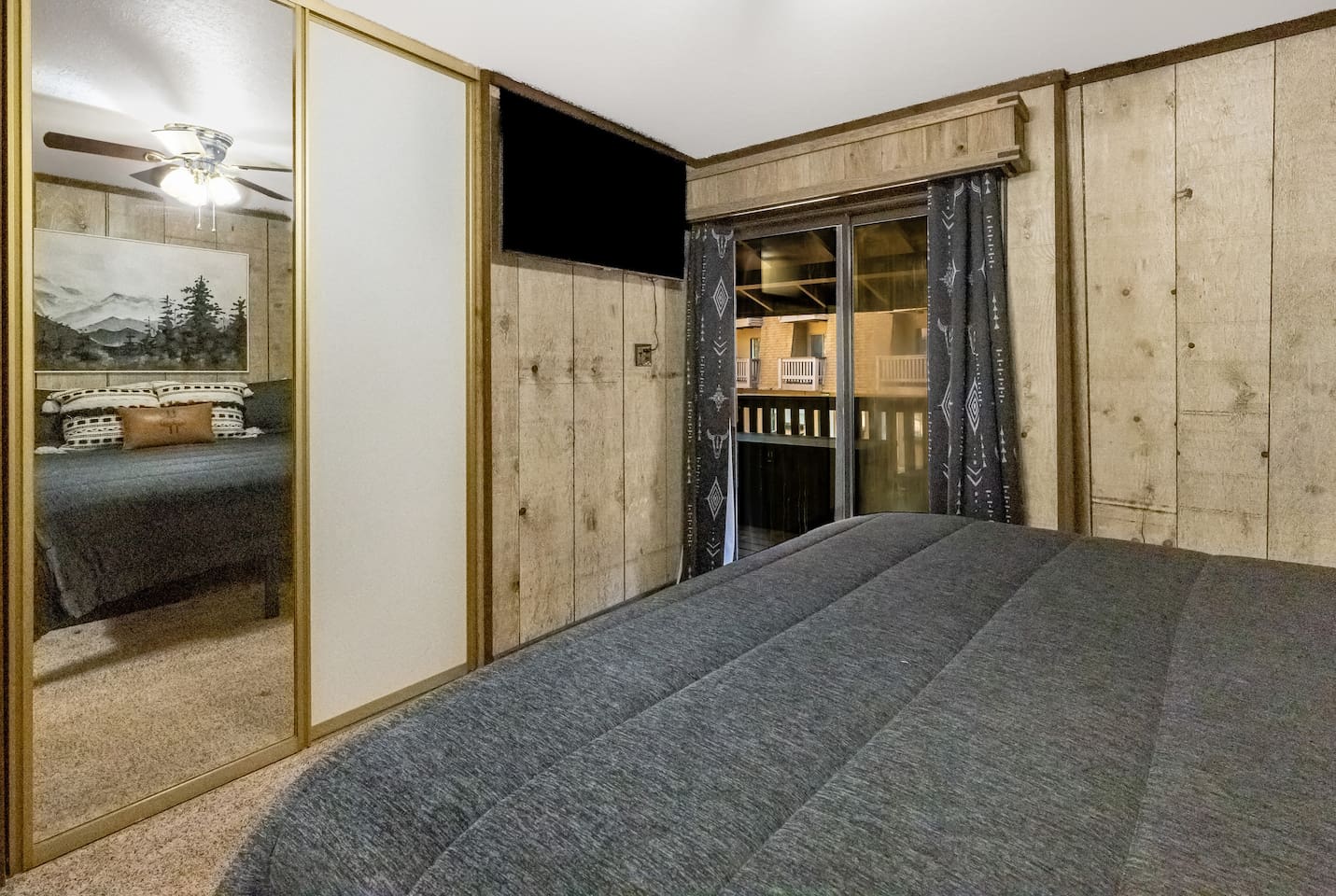 Tv's in each bedroom and sliding door access to the back porch