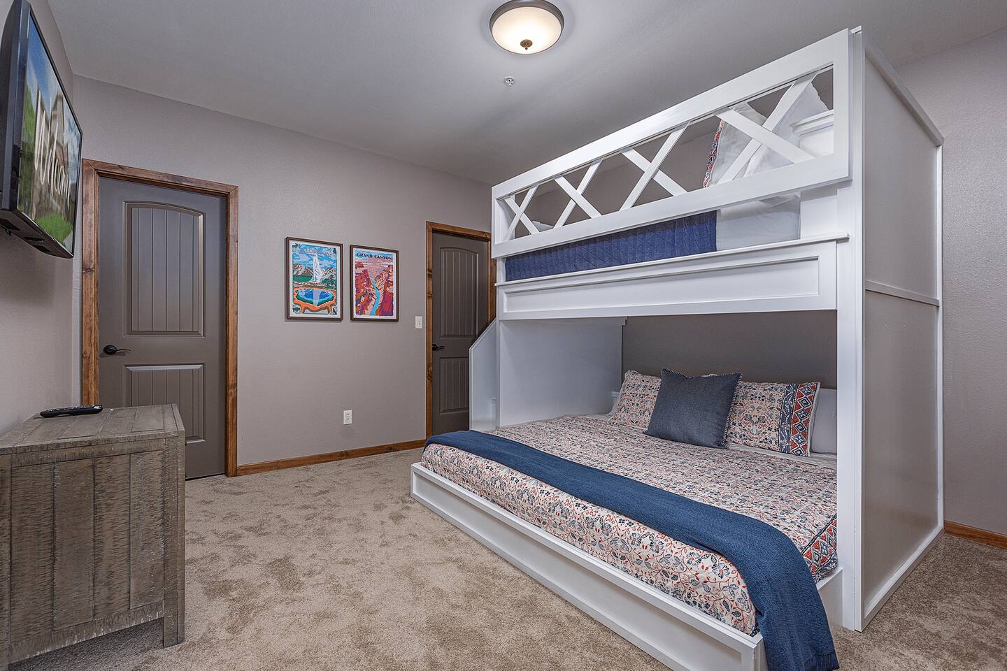 Lower Level Full over King Bunk w/40 Smart TV, walk in closet, and attached bathroom