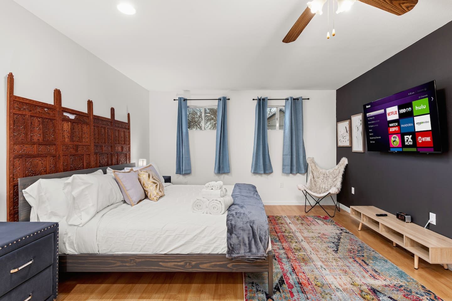 Drift off to sleep in this masterfully crafted casita bedroom, boasting a stunning antique hand-made wooden headboard and soothing decor, for a touch of elegance and serenity during your stay.