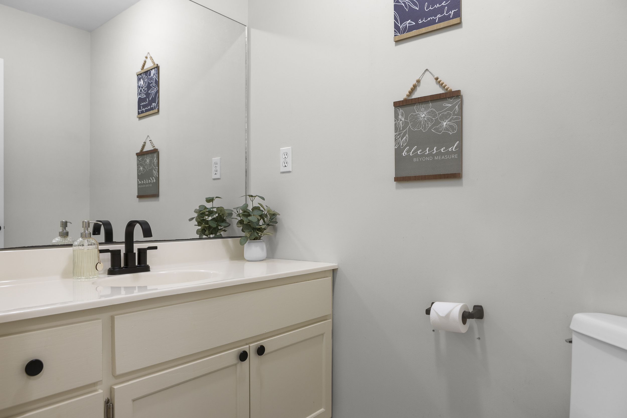 Half Bathroom 2: Bright and inviting, with stylish decor and modern fixtures for relaxation!