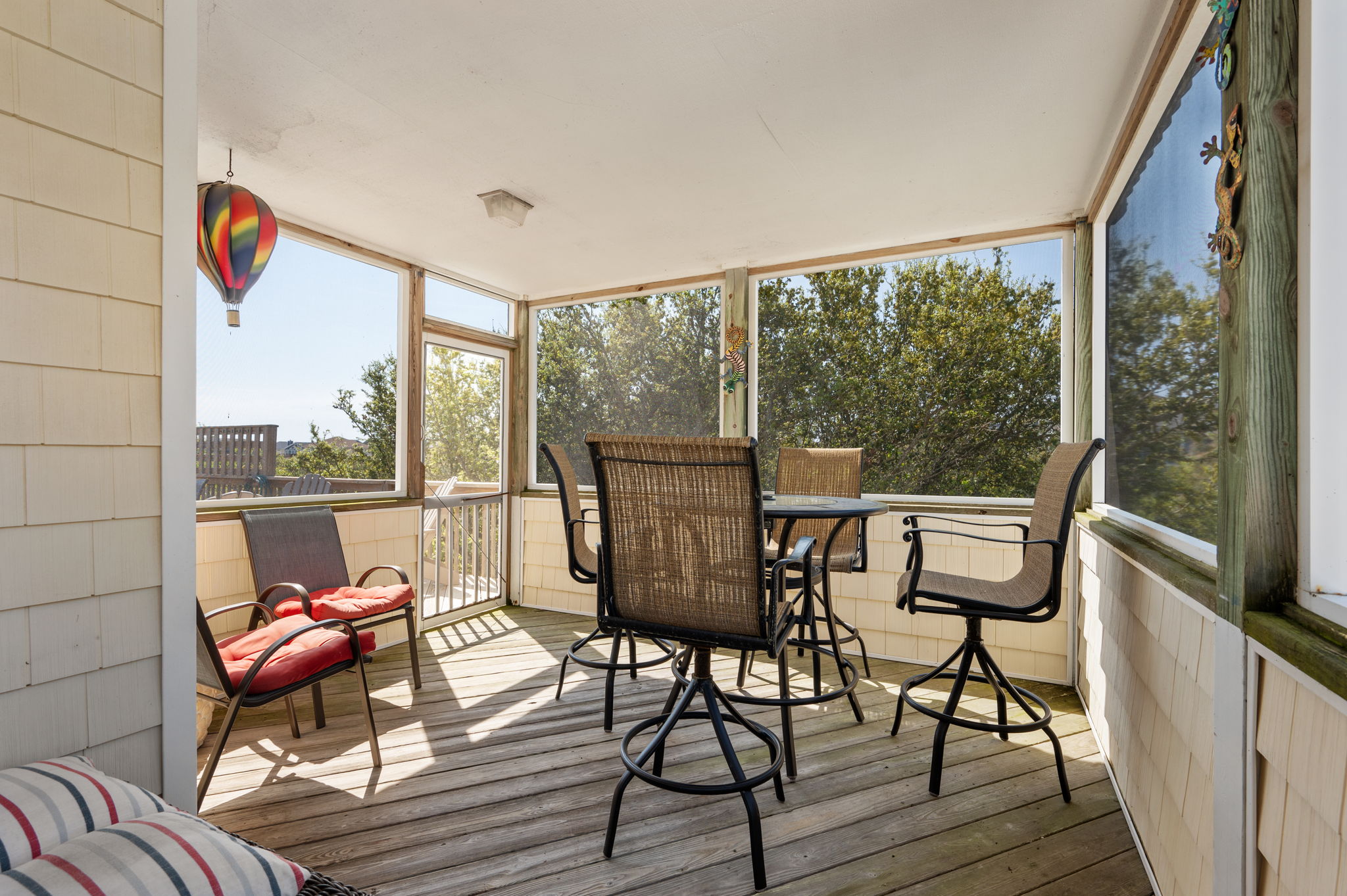 Screened porch with outside dining table for 4