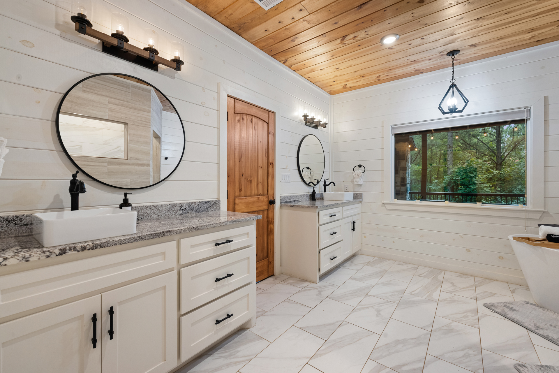 Luxury bathroom comfort with room to slow down and breathe deeper. 
From the walk in shower to the peaceful cabin atmosphere, this ensuite was made for unwinding after a day in the pines.