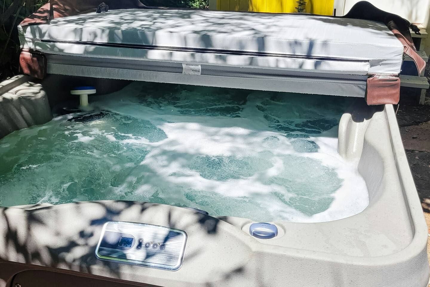 - Bubbling hot tub perfect for unwinding after a day of adventure  
- Surrounded by natural shade for a private, relaxing soak outdoors  
- Heated water and gentle jets offer year round comfort and rejuvenation  